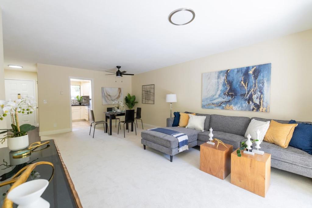 Open,airy,spacious,remodeled,updated,and quiet downstairs unit! Entryway with upgraded wide plank laminate floor leads into the spacious living room and the adjoining dining room with a ceiling fan that opens to the large patio in backyard with a storage room,great for entertaining family!Remodeled,updated kitchen with stone counters,stainless steel appliances,painted cabinets,designer tiled backsplash,refrigerator,new stainless steel electric range,new programmable smart recessed lighting!New fresh interior paint,new luxury carpets throughout.Remodeled,updated bathroom,new toilet.Laundry room with a washer and dryer combo unit.Assigned parking in the covered Carport plus plenty of open parking spaces.Community solar heated in-ground pool,rec room,basketball court,trails.Walk to the 9.5-acre city park with 4 tennis courts,playground,picnic and BBQ areas.Walk to top rated Curtner Elementary School.Easy access to HWY 680, 880 and 237 and Bart.Easy commute to major Companies (NVidia, Cisco, Tesla, ASML, etc.) and the Great Mall Shopping Center, 99 Ranch and Costco.HOA covers earthquake, flood insurance, water, sewer and garbage. This unit is NOT in flood zone.This unit is at one of the best locations of the whole community with plenty of sunlight and mountain view from patio yard.