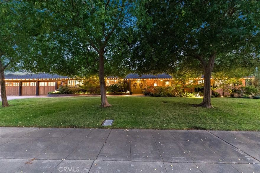 Step into timeless mid-century elegance with this 1954 Taylor Wheeler-designed residence, located in the Fresno High Historic District. Offering 3,155 sq. ft. of living space on an expansive double lot, this 4-bedroom, 4-bath masterpiece perfectly blends architectural distinction with modern comfort. Each bedroom boasts its own en-suite bath, while the rare finished basement provides endless versatility - ideal as a media retreat, playroom, or creative studio. Inside, clear white fir tongue-and-groove millwork showcases the home's craftsmanship, complemented by abundant built-ins and exceptional storage seldom found in homes of this era. A car enthusiast's dream, the tandem 4-car garage boasts three front entries, a rear garage door, breezeway access to the backyard, and two dedicated workshop/storage areas. Outdoors, the entertainer's backyard features a sparkling pool with fountains, lush landscaping, and a built-in barbecue with bar - perfect for gatherings large or small. Sustainability meets savings with 55 solar panels, significantly reducing energy costs.. Beyond energy efficiency, this home offers peace of mind with a recently completed pest clearance. Paired with its generous double parcel, architectural pedigree, and exceptional blend of authenticity and comfort, this residence is a rare opportunity to own a true mid-century gem in one of Fresno's most distinguished neighborhoods.