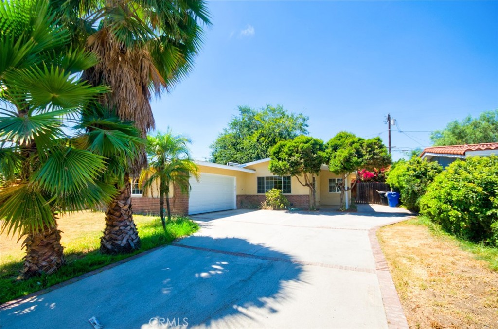 Welcoming to this beautifully upgraded single story home nestled in a desirable neighborhood of Azusa! this charming residence offers 4 spacious bedrooms and 2 full bathrooms, encompassing 1352 square feet of comfortable living space. Step inside to discover a bright and open living area with fresh painting and stylish newer flooring. The home has been thoughtfully remodeled, featuring updated bathrooms and a refreshed kitchen complete with newly painted cabinets and a brand-new gas stove. Adjacent to the kitchen is a generously sized dining area, perfect for everyday meals or entertaining guests. All four bedrooms are well-proportioned, providing ample space for a large family or versatile use such as a home office or guest room. The backyard offers a private and inviting space-ideal for gatherings, barbecues, or simple relaxing with loved one. A long driveway offers ample parking space for up to 5 cars-an added convenience rarely found! Situated in a quiet, peaceful neighborhood, this home is just minutes from Azusa Pacific University and offers convenient access to the 210 Freeway. With no HOA fees and low property tax rates, this is an excellent opportunity you won't want to miss!