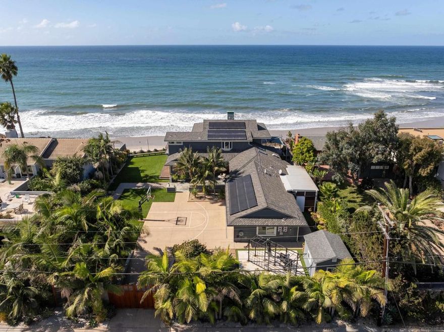 Presenting an incredible DOUBLE OCEANFRONT lot in beautiful Solana Beach, offering breathtaking panoramic ocean views and expansive 180 degree views of the coastline from La Jolla to San Clemente. This property features a sprawling outdoor living space, rare for an oceanfront property. Fully rebuilt in 2010 and remodeled in 2018, this custom masterpiece offers 4 bedrooms and 4.5 baths, showcasing exceptional craftsmanship. Highlights include 10-inch wide plank German oak flooring, a gorgeous gourmet kitchen with huge island and top-tier appliances, bar, media room, 3 car garage, and a dedicated surf storage room. Walls of big picture windows enhance the incredible view while floor-to-ceiling sliding doors provide the perfect, seamless indoor/outdoor feel from the dining room to the large porch. More outdoor features include a gym, hot tub with vast ocean views, huge turf lawn, basketball half court, fruit trees, and a flourishing garden. In addition, full house solar offers super efficient utilities and extremely low electric bills. This is a once in a lifetime opportunity!
