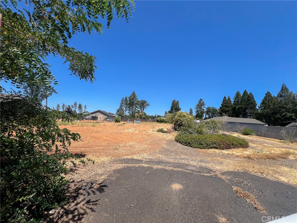 Prime Opportunity in Central Paradise. This .45-acre property, zoned T-R (Town Residential), offers a rare chance to rebuild in an excellent location with flexible development potential. Before the 2018 fire, the lot was home to two residences and a studio apartment, making it ideal for multi-family living or investment purposes. Existing infrastructure includes two septic systems (condition unknown) it had two power meters, natural gas service to the front house, and propane to the rear—plus Paradise city water service is still active. Fencing remains in place, helping to define the property's layout and making future planning easier. This lot is a smart option for investors, builders, or those looking to create a custom living setup. Check with the Town of Paradise for the many potential uses under Town Residential zoning. Don’t miss out on this opportunity to be part of the town’s thoughtful rebuild and future growth! Buyer to verify this and all information provided to their satisfaction.