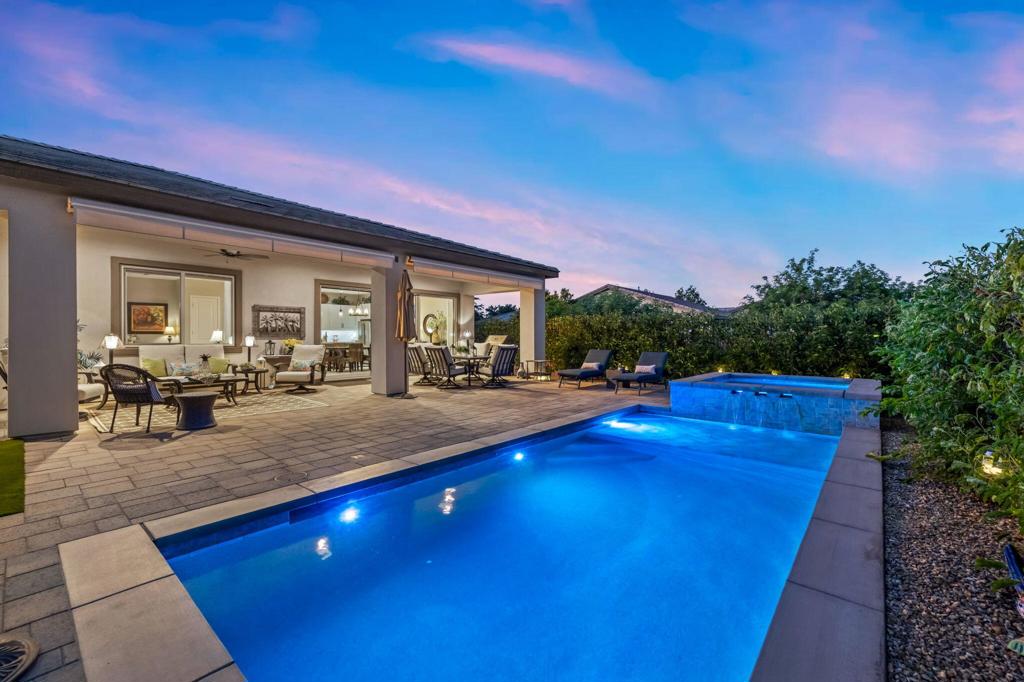 TRILOGY POLO CLUB: OVER $150K IN UPGRADES!!! --> WOW!!! <-- **OPEN THIS SAT 10/11 10:00-12:00 & THIS SUN 10/12 11:00-1:00. COME SEE!!** One of the most highly upgraded homes in Trilogy Polo - you're getting $150k in upgrades for only $965k. What a deal! No neighbors directly behind or beside the yard -- complete privacy and open space on all sides.This 2,367 sq. ft. single-level home offers 3 bedrooms, 3 baths, PLUS a den/office (or 4th bedroom), all just steps from the clubhouse. The open-concept great room is bright and spacious, featuring stunning wood-look tile floors, custom window treatments, and pocket sliding doors for seamless indoor-outdoor living.The chef's kitchen is fully loaded with quartz counters, a custom herringbone backsplash, a large prep island with pendant lighting, a 6-burner cooktop with designer hood, double ovens, and walk-in pantry.The primary suite is a private retreat with upgraded Berber carpet, dual vanities, a glass-enclosed tiled shower, and a spacious walk-in closet.Out back, you'll find a resort-style yard built for entertaining -- complete with a beautiful Teserra Pool with Pebble Tec spa featuring triple waterfalls, a tanning shelf, an expansive paver patio, and a covered area for shade and dining.No need to renovate or upgrade a single thing -- this home is truly turnkey, with FAR MORE UPGRADES THAN COMPETING LISTINGS. Topped off with solar, electric window coverings, huge awnings, air-conditioned garage with extra golf cart space, and a premium location near the clubhouse -- this is the by far best deal in Trilogy! DON'T LOOK AT OTHERS TILL YOU SEE THIS!!
