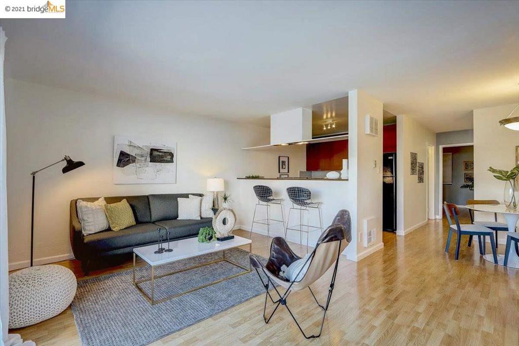 Fantastic updated and sunny condo! One of the larger 1 bedroom units. Updated Kitchen is open the living room and has walnut finish cabinets with "Corian" counters and handsome honey comb backsplash. Laminate hardwood floors throughout the main living areas. Updated bath has a "marble" surround for the tub and contemporary solid surface vanity top with the same honeycomb backsplash utilized in the kitchen. Catch the wonderful sunsets from your private balcony overlooking the estuary! Best pool and hot tub in Oakland! Also, sauna, tennis courts & fitness room. Centrally located in one the vibrant Jack London Square neighborhood with all the restaurants, shops, Bay Trial, SF Ferry, Brooklyn Basin & a few blocks from BART!