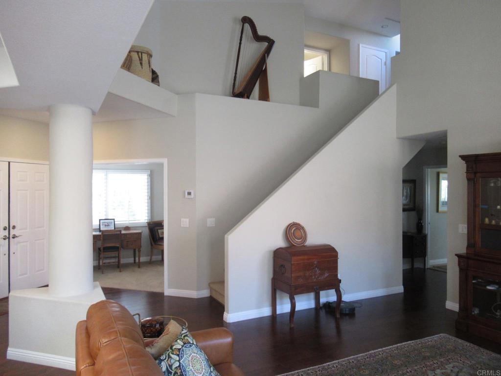 Furnished rental, detached home, in gated Ocean Hills Country Club, the 55+ paradise in San Diego's coastal North County. Steps from the clubhouse, where you'll be able to enjoy all that OHCC has to offer: an 18-hole resident only golf course, tennis & pickle-ball courts, swimming, bocce, billiards, exercise rooms, other rooms for various interests, and a large auditorium. Mystra floor plan, with primary and guest bedrooms, plus an office, downstairs, and a bedroom (with Murphy bed) and bath upstairs. Wood flooring, with carpet in bedrooms, and tile in bathrooms. Stainless steel kitchen appliances. Plantation shutters. Open in back, tile patio, with a peek at the ocean on a clear day. One year lease, owner may consider 6 months. No smokers, sorry no pets.