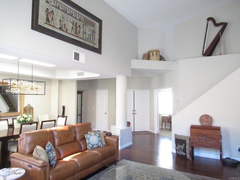 Furnished rental, detached home, in gated Ocean Hills Country Club, the 55+ paradise in San Diego's coastal North County. Steps from the clubhouse, where you'll be able to enjoy all that OHCC has to offer: an 18-hole resident only golf course, tennis & pickle-ball courts, swimming, bocce, billiards, exercise rooms, other rooms for various interests, and a large auditorium. "Mystra" floor plan, with primary and guest bedrooms, plus an office, downstairs, and a bedroom (with Murphy bed) and bath upstairs. Wood flooring, with carpet in bedrooms, and tile in bathrooms. Stainless steel kitchen appliances. Plantation shutters. Open in back, tile patio, with a peek at the ocean on a clear day. One year lease, owner may consider 6 months. No smokers, sorry no pets.
