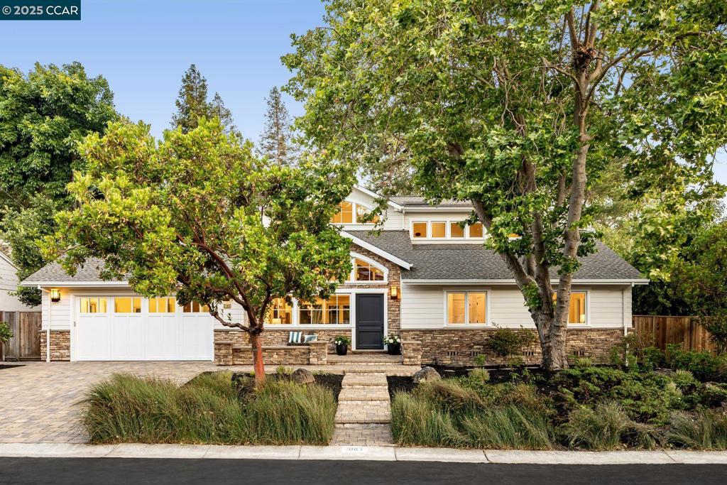 This family-friendly home is in an exceptionally family-friendly neighborhood, just a 3-minute walk to Burton Valley Elementary. The welcoming exterior beckons residents and guests from the street. Enter to a grand living room under skylights and a 25-foot ceiling. The living room leads seamlessly to the open-concept kitchen, with elite appliances, a wine refrigerator, garden views, a walk-in pantry, and a large island offering bar seating. The dining area sits adjacent, and that in turn leads residents and guests to the family/TV room for conversation, relaxation and entertainment. Patagonian rosewood flooring runs throughout the home. Four bedrooms and 2.5 baths complete the main floor, under elevated ceilings. The principal suite and another bedroom are upstairs, under elevated ceilings and more skylights; many of the skylights vent electronically to the fresh outside air. The principal suite offers an exceptionally large walk-in closet, sitting nook, and en-suite bath. Work from home is easy in the spacious office nearby, which surveys the back yard below. That yard features a grassy play area, spacious patio, and mature trees that offer pleasant shade. Parking and storage are easy in the oversized garage, and any number of guests can park on the driveway and quiet street.
