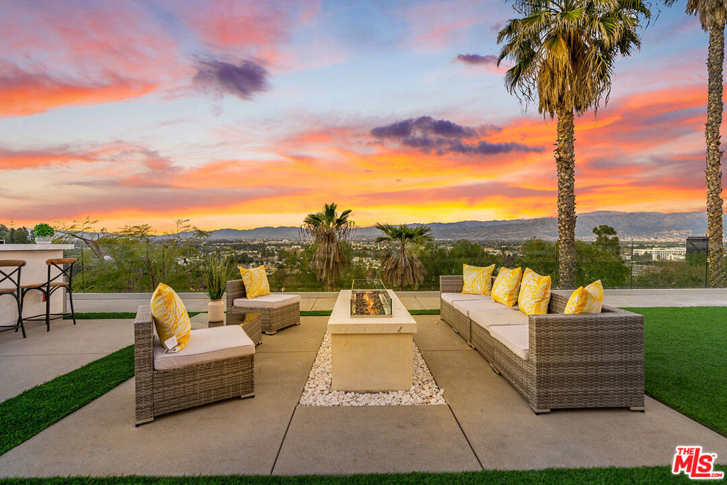 This home and all our listings are available immediately to assist displaced victims from the fires. Available fully furnished and turnkey for short, midterm, or long term lease! Exquisitely updated view compound in the heart of Studio City. Living room blends seamlessly with dining area and kitchen presenting the perfect combination of grandeur and functionality. Natural light floods the public rooms. Chefs kitchen with top of the line appliances and breakfast bar replete with ample storage. Sliding pocket doors lends itself to a generous yard featuring outdoor kitchen with bar seating, fire pit and unparalleled views from every angle. Primary suite facing Northern views is the ultimate retreat with walk in closet and resort like oversized bath with separate shower and tub. Three additional bedrooms and direct access garage complete this rare trophy home. An exceptional opportunity to acquire a property at the end of a cul-de-sac with incredible privacy, all while being a few moments away from Ventura Blvd, Highways, Universal City and the best Los Angeles has to offer.