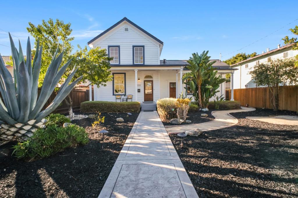 Welcome to this beautifully remodeled two-story home nestled in the historic Old Quad neighborhood - a rare opportunity to own a piece of Santa Clara's history. This isn't just a starter home - it's a keeper. Mills Act approved, the property offers approximately 80% annual property tax savings*, making it as smart financially as it is stunning aesthetically. This exquisite 4-bedroom, 3-bath residence perfectly blends timeless architectural charm with modern upgrades across 1,816 sq. ft. of light-filled living space. Enjoy elegant hardwood floors, abundant natural light, and beautifully crafted details throughout. The thoughtful layout features two bedrooms on the main level ideal for multigenerational living or hosting guests. The chef-inspired kitchen is designed for both everyday cooking and entertaining, while recent updates bring peace of mind: foundation work completed in 2012, new electrical and plumbing systems, and a fully paid-off Tesla solar roof for energy efficiency. Located just minutes from Nvidia, Apple, and other leading tech employers, this home offers unmatched convenience alongside historic character. Don't miss this rare opportunity - this ones a keeper. *Estimate only, buyer to verify Mills Act savings withcounty.