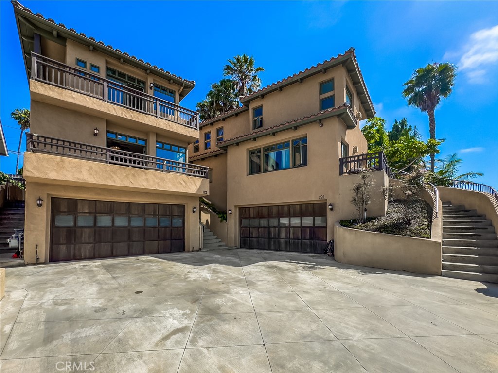 Stunning, luxury duplex located close to world famous beaches, shopping and fine dining. All situated in the quaint setting of downtown San Clemente. Built in 2005 all upgraded details throughout. Very open and airy multi-level units. Unit A: 2 bedroom 2 1/2 bath + huge bonus room off garage. Unit B : 3 bedroom 3 1/2 bath. Both units have 2 car attached garages with directed access. Both units have numerous patios and decks. Included is an ocean view roof top deck. The kitchens have upgraded appliances, granite counters & islands, truly gourmet kitchens. Unit B has 2 fireplaces, and are suited for owner occupied living or investor income. All bedrooms have walk-in closets and en-suite baths.
Multiple levels create a sense of creativity. Spanish architecture and Turn-key condition. No HOA or Mello Roos. Condominium conversion potential, see city for verification.