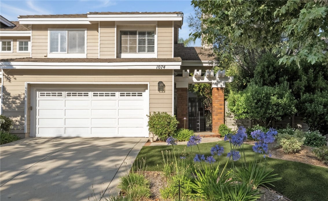Nestled in the highly desirable gated Kensington Park community, this impeccably maintained townhome offers 2,113 square feet of comfort, style, and convenience. A charming courtyard entry anchored by a mature citrus tree sets a welcoming tone as you approach. Upon entry you are greeted by soaring 20+ foot ceilings, rich colored wood flooring, and a fireplace. The remodeled kitchen boasts a brand-new stainless steel refrigerator, dishwasher, double oven, wine fridge, and generous counter space. It is open to a den with recessed lighting, ceiling fan, and direct access to a private pergola-covered patio—perfect for entertaining, relaxing, or enjoying alfresco dining. Upstairs, across the lofty catwalk, the primary suite features vaulted ceilings, a spa-like bath with dual vanities, soaking tub, separate shower, and two large closets (one walk-in), while secondary bedrooms offer fresh carpeting, high ceilings, and ample storage. Additional features include direct access two car garage, fresh paint throughout , a full laundry room with sink and storage, and peaceful mountain and neighborhood views. Community amenities include a sparkling pool and spa, plus nearby hiking and biking trails. Ideally located just minutes from Pavilions, Starbucks, Gelson’s, and The Shoppes at Westlake Village—with popular dining, shopping, and lakefront spots like Boccaccio’s only moments away—this home delivers the perfect blend of privacy, security, and lifestyle-driven living. Move-in ready now! All applications to be submitted via Rentspree using the following link https://apply.link/6COIydk