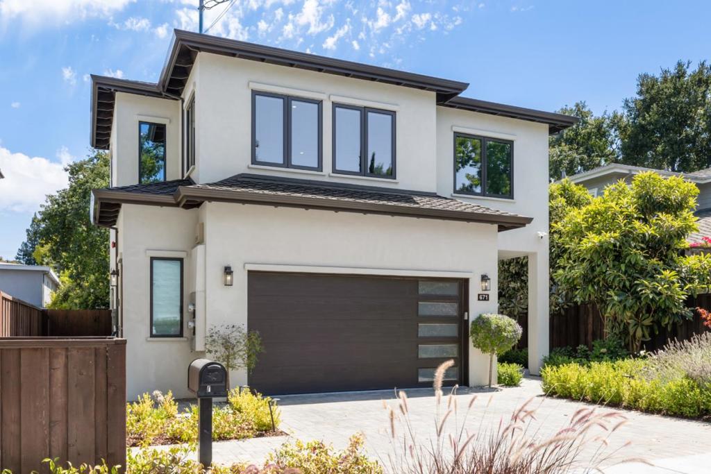 Modern Luxury in Prime Allied Arts! Custom-built in 2023, this stunning 5 BD / 5.5 BA home offers 3,270 sq ft of light-filled living on a 5,645 sq ft lot. Ideally located just steps from the Allied Arts Guild and walking distance to downtown Menlo Park, Palo Alto, Stanford University, Stanford Shopping Center, and Stanford Hospital. The open-concept layout features a chefs kitchen with high-end appliances and granite countertops perfect for entertaining. Each bedroom boasts an en-suite bath, including a luxurious primary suite with private balcony, spa-like bath, soaking tub, and dual vanities. A first-floor suite is perfect for guests or a home office. Smart home amenities include security cameras, video doorbells, alarm system, and EV charger. Eco conscious design highlights triple-pane windows, sustainable roofing, and 8 KW solar panels. Enjoy nearby parks, top-rated Menlo Park schools, and favorite grocers like Draegers and Trader Joes. Easy access to Caltrain and a short commute to Meta, Google, Apple, and other leading tech campuses.