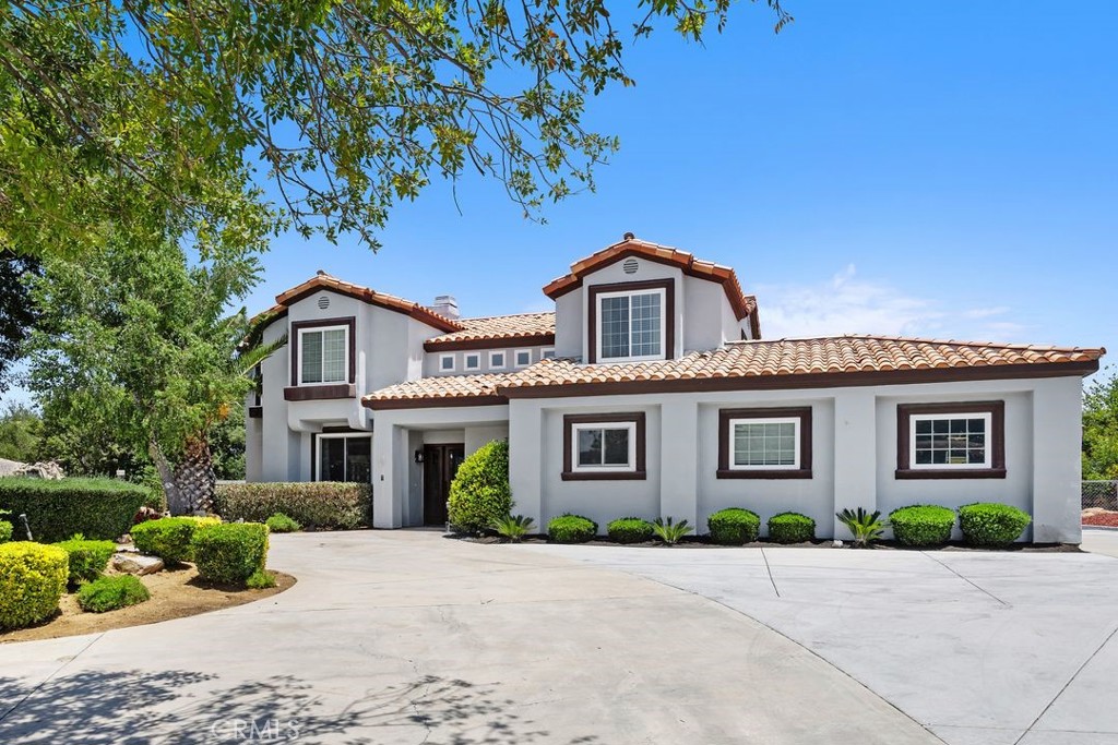 Welcome to this EXQUISIT Equestrian property in the La Cresta Highlands with PANORAMIC VIEWS, and an ENTERTAINERS dream backyard! This amazing property offers a peaceful location perched perfectly to capture sunrise, sunsets and mountainous views. Upon entering you will immediately notice the architectural details of soaring ceilings, remodeled fireplaces, LVP flooring throughout, and many custom features. The lower level offers a large, remodeled kitchen that opens to the great room and dining room, complete with a cozy fireplace and scenic views throughout. The living room boasts cathedral ceilings that open to the second floor and offers a relaxing fireplace to enjoy. The first floor also includes a Guest Bedroom, Bathroom, and Laundry/Mud Room conveniently located off the garage. The second floor offers two Guest Rooms, Guest Bathroom, and the Primary Suite and Bath. The current owner has also cleverly converted a previous adjoining bedroom to the Primary Bedroom to a HUGE walk-in closet! The Primary Suite and Bathroom have been beautifully remodeled. The Bedroom/Bathroom offers a dual area fireplace to enjoy while watching TV or taking a bath in the beautiful soaking tub. You may also enjoy a cup of coffee or watch the stars from the attached deck off the Primary Suite. The backyard space is an ENTERTAINER’S delight, complete with a sparkling pool, jacuzzi, fireplace area, sunning decks, bar/BBQ area, and lots of room for guests and family! The horse corals are conveniently located at the rear of the property with horse and hiking trails adjoining the parcel, with the property landscaping conveniently watered with a sprinkler system. This gorgeous, remodeled home has it all, and easy access to nearby schools, shopping, freeways and access to several rural community trails. Don’t miss this amazing opportunity to live the La Cresta lifestyle, with a home that has it all! Welcome Home!