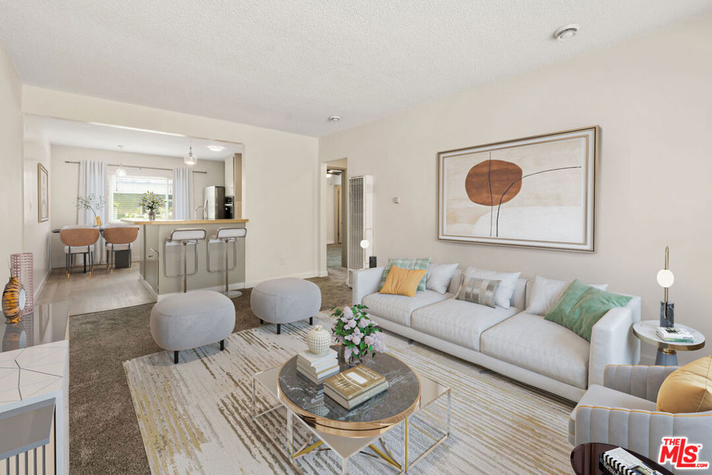 Welcome to this beautifully refreshed 2-bedroom, 1.5-bathroom top-floor home in the heart of Playa del Rey. Nestled in a boutique 4-unit building just moments from the beach and popular local dining spots, this bright and airy unit offers a perfect blend of comfort and convenience. Featuring freshly renovated bathrooms, paint, and brand-new carpeting, this unit boasts a spacious living area filled with natural light. The eat-in kitchen offers ample storage and a new dishwasher and oven, creating a stylish and functional space. A generous wrap-around counter makes a great spot for casual dining or entertaining. The two bedrooms are positioned on opposite sides of a spacious shared full bathroom, offering privacy and functionality. One of the bedrooms features an en-suite powder room for added convenience. Triple-paned windows throughout create a quiet, serene atmosphere, while the thoughtful layout ensures a comfortable and well-balanced living space. Residents have access to a community laundry utility room with a washer and dryer and one designated space inside a shared two-car garage. Additional street parking is available. Situated just minutes from the beach, restaurants, and shopping, this home offers the best of Playa del Rey's laid-back coastal lifestyle.