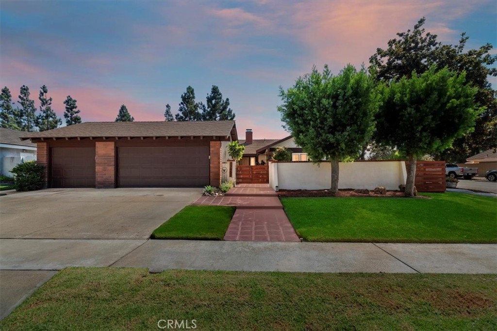 Welcome to 17902 Lucero Way — where timeless elegance meets modern comfort, just minutes from Tustin Ranch amenities like the Marketplace & Golf Club, Nestled on a serene, tree-lined street, this beautifully remodeled 4-bedroom, 3-bath, luxury home with a gorgeous energy-efficient heated pool, a shallow end & a nine-foot deep end, on a corner lot with plenty of parking, captures the very best of Orange County living.
Enter through striking custom double wood doors into a spacious, light-filled home, with an open-concept floor plan, soaring ceilings, abundant natural light with full wall windows overlooking the private back yard pool. The remodeled chef’s kitchen features quartz countertops, stainless steel built-in appliances, a five-burner range, modern cabinetry, recessed lighting, steam-exhaust system, creating the perfect gathering place for family cook time. A fantastic wood & gas burning brick fireplace welcomes you at the entry & anchors the living room. Air Conditioning & ductwork have been recently updated.
The spacious primary suite offers a spa-inspired bath & modern, updated, lovely tile throughout the home, three additional oversized bedrooms with nice-sized closets. Newly remodeled baths with gorgeous tubs, custom tile, sleek counters, & updated cabinets. Multiple sliding glass doors frame sweeping views of the backyard & entertainer’s patio, creating seamless indoor-outdoor living.
Outdoors, enjoy your sparkling inground pool with custom coping, cement deck, & lush landscaping. A private block-wall courtyard patio in the front yard provides a tranquil retreat, while the landscaping & hardscaping, brickwork & cemented walkways, patios make easy-care grounds, making entertaining effortless. The home also boasts a massive three-car garage with abundant storage.
Located within the highly rated Tustin Unified School District — with award-winning schools including Foothill High, Columbus Tustin Middle School is walking distance, and Guin Foss Elementary — close to Peters Canyon hiking & biking trails. Quick freeway access (5, 55 & 261) plus proximity to John Wayne Airport ensure unmatched convenience.
This is more than a home — it’s an entertainer’s paradise and a private retreat all in one. With its perfect blend of location, design, and amenities, 17902 Lucero Way delivers the ultimate Southern California lifestyle you’ve been dreaming of.