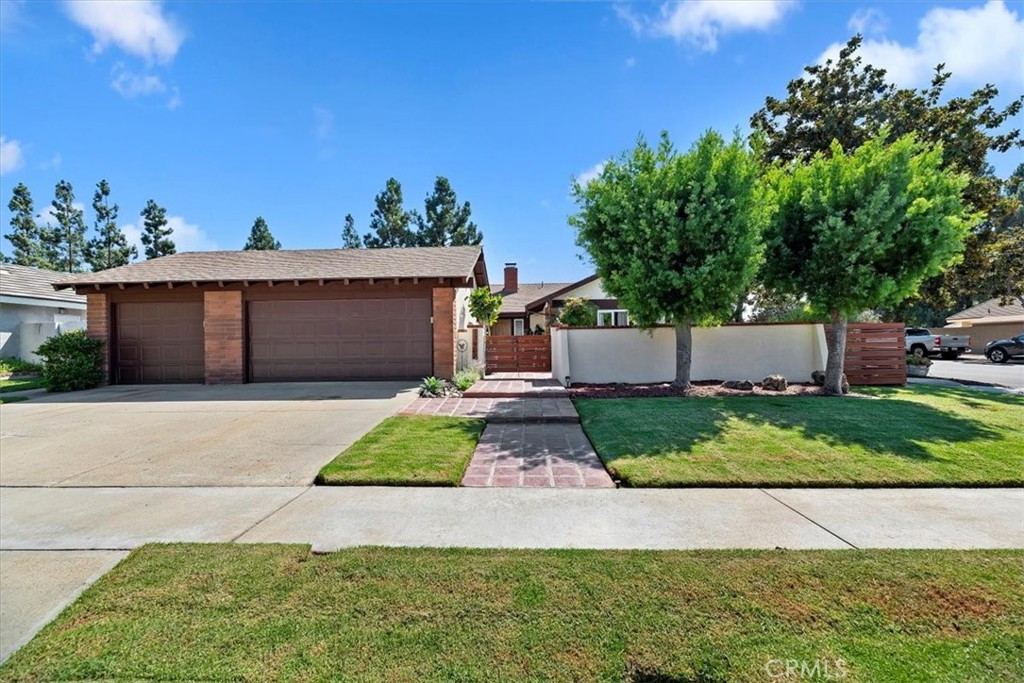 Welcome to 17902 Lucero Way — where timeless elegance meets modern comfort, just minutes from Tustin Ranch amenities like the Marketplace & Golf Club, Nestled on a serene, tree-lined street, this beautifully remodeled 4-bedroom, 3-bath, luxury home with a gorgeous energy-efficient heated pool, a shallow end & a nine-foot deep end, on a corner lot with plenty of parking, captures the very best of Orange County living.
Enter through striking custom double wood doors into a spacious, light-filled home, with an open-concept floor plan, soaring ceilings, abundant natural light with full wall windows overlooking the private back yard pool. The remodeled chef’s kitchen features quartz countertops, stainless steel built-in appliances, a five-burner range, modern cabinetry, recessed lighting, steam-exhaust system, creating the perfect gathering place for family cook time. A fantastic wood & gas burning brick fireplace welcomes you at the entry & anchors the living room. Air Conditioning & ductwork have been recently updated.
The spacious primary suite offers a spa-inspired bath & modern, updated, lovely tile throughout the home, three additional oversized bedrooms with nice-sized closets. Newly remodeled baths with gorgeous tubs, custom tile, sleek counters, & updated cabinets. Multiple sliding glass doors frame sweeping views of the backyard & entertainer’s patio, creating seamless indoor-outdoor living.
Outdoors, enjoy your sparkling inground pool with custom coping, cement deck, & lush landscaping. A private block-wall courtyard patio in the front yard provides a tranquil retreat, while the landscaping & hardscaping, brickwork & cemented walkways, patios make easy-care grounds, making entertaining effortless. The home also boasts a massive three-car garage with abundant storage.
Located within the highly rated Tustin Unified School District — with award-winning schools including Foothill High, Columbus Tustin Middle School is walking distance, and Guin Foss Elementary — close to Peters Canyon hiking & biking trails. Quick freeway access (5, 55 & 261) plus proximity to John Wayne Airport ensure unmatched convenience.
This is more than a home — it’s an entertainer’s paradise and a private retreat all in one. With its perfect blend of location, design, and amenities, 17902 Lucero Way delivers the ultimate Southern California lifestyle you’ve been dreaming of.