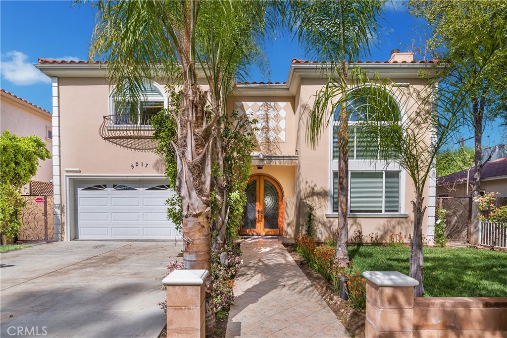 Welcome to the home that has it all! You will appreciate the high ceilings and recessed lighting throughout the home. Beautiful custom double doors open to a stunning crystal chandelier in the entry and the large, airy living room complete with fireplace. Adjecent to the living room is the dining room and staircase to the upstairs. The staircase design complements the front double doors. The spacious kitchen features stainless steel appliances, a large window overlooking the back yard, and a large island with plenty of storage and place to eat in the kitchen. The kitchen opens to a nice spacious TV room with access to the outside. Enjoy five bedrooms, five baths with each bedroom having its own en-suite bathroom. There is one bedroom and bathroom downstairs and the rest are upstairs. The light and bright home features a large master bedroom with a walk in closet, balcony perfect for morning coffee and a generous sized master bath with dual sinks, vanity, large soaking tub and a large walk in shower with multiple shower heads. The backyard features a spa to relax and unwind. It is close Ventura Blvd, shopping centers, restaurants, house of worship and the local library.