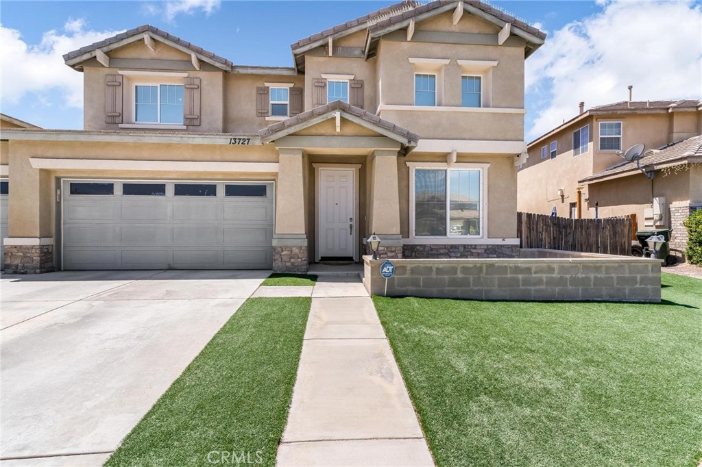 Located on a quiet cul-de-sac in a desirable Victorville neighborhood, this spacious 5 bedroom, 3 full bathroom home is perfect for multi-generational living. It features a full bedroom and full bathroom downstairs, two separate living areas, a large upstairs loft, indoor laundry room, and a huge master bedroom with a walk-in closet. The open-concept kitchen is ideal for entertaining, and the layout offers flexibility for any lifestyle. Enjoy a low-maintenance front and back yard with turf and dry landscape—perfect for high desert living. Solar panels are included with a per-usage agreement for added energy savings. Additional features include a tile roof and a beautiful backyard space. Conveniently located just 10 minutes from the 15 Freeway entrance, close to major shopping centers, restaurants, parks, and schools. Part of the Victor Valley Union High School District with nearby optional private and Montessori schools. This is a rare find in the High Desert—don’t miss your chance to make it yours!