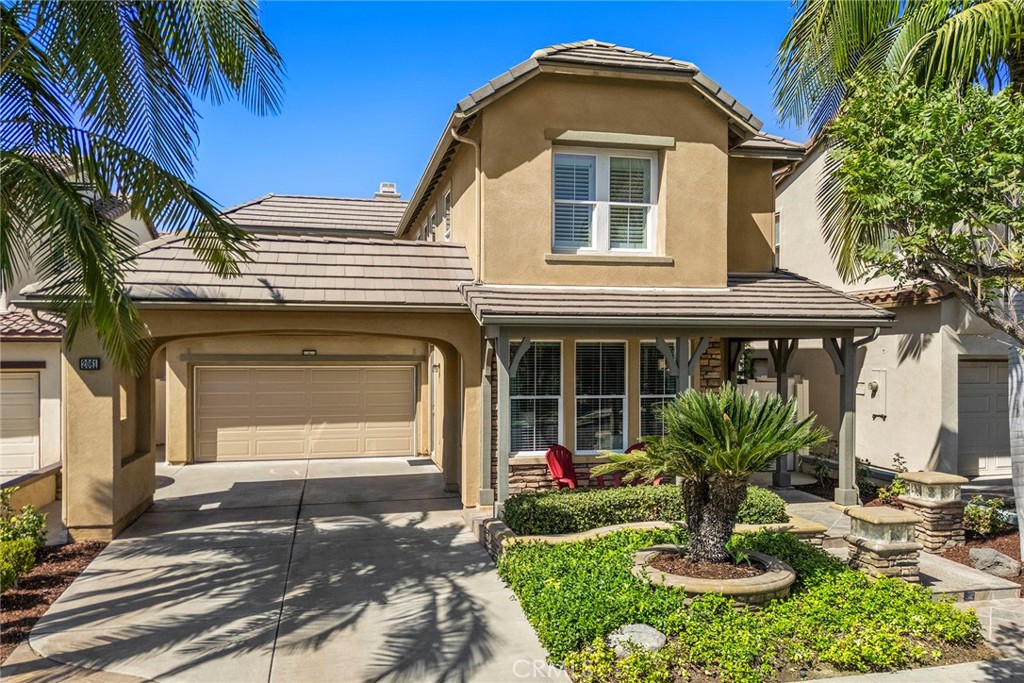 Live a life of ease and convenience within the coveted Amerige Heights master-planned community, enjoying an ideal location steps away from both Fisler K-8 and Sunny Hills High Schools, 2061 Ward Street is now presented to the market for the first time since new, this desirable Alcott residence 2, with a DOWNSTAIRS BEDROOM AND BATHROOM, home was built by highly regarded Lennar Homes. Mature palm trees and quality stonework set the tone for a quality and well-maintained home. The inviting front porch is an ideal place to sit and enjoy this quiet tree-lined street. Stepping inside, a thoughtfully refreshed interior awaits featuring NEW INTERIOR PAINT, 2 year new HVAC and ducting and newer gray tone LVP flooring in all living areas providing a crisp and bright home. The formal living and dining rooms feature numerous windows, recessed lighting and a French door that leads to the side driveway. At the heart of the home is the generously sized kitchen with center island, granite counters and timeless white cabinetry, appliances include double ovens, 5 burner cooktop and built-in microwave. A convenient built in desk area is found in the dining area along with ample pantry space. Flowing perfectly from the kitchen, the family room enjoys a gas fireplace and sliding door to the backyard. A convenient downstairs bedroom and ¾ bathroom around found down the hall leading to the inside laundry room, with sink and provides easy access to the 2-car attached garage. Upstairs, an ideally positioned built-in desk is found in the landing. Tucked at the rear of the home, the primary suite is spacious with plantation shutters and an impressively sized en-suite bathroom with dual sink vanity and separate shower and bathtub, the walk in closet is massive providing ample room. Two additional bedrooms share equal access to the jack n jill bathroom between them, all enjoying plantation shutters. The low maintenance backyard is private and has a covered patio, stylish stone planter walls and mature fruit bearing trees including lemon, lime and 2 avocado trees. Steps from Gardener Park and ample greenbelts, walking trails and of course mere moments from the Amerige Heights shopping center.