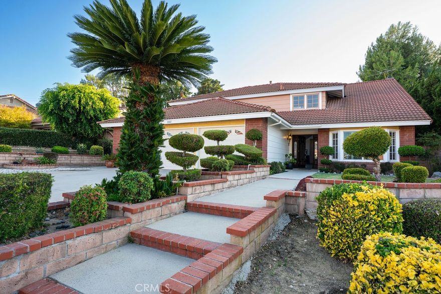 Discover this stunning 5-bedroom, 3-bathroom pool home, ideally located in the highly sought-after community of Hacienda Heights. Renovated, the homeowner transformed the dining room into a spacious 6th bedroom, featuring wide-plank laminate flooring. The room also includes a non-permitted ensuite bathroom, complete with a ceramic tile shower surround, ceramic tile flooring, and a custom vanity with a granite countertop. Upon entering the house, you'll be welcomed by soaring vaulted ceilings. To the left, the expansive living room boasts wide-plank laminate flooring and elegant wood shutters adorning the windows. The generous family room, featuring a cozy fireplace, seamlessly flows into the chef-inspired kitchen, which showcases two-tone white/light blue cabinetry, stainless steel appliances, ceramic tile flooring, and Corian countertops.

All four bathrooms have been updated, featuring ceramic flooring, tile-surround showers, granite countertops, and custom cabinetry. The main floor offers a thoughtfully designed layout with two bedrooms and two bathrooms, providing optimal convenience and flexibility. A wrought iron staircase leads to the second floor, where the primary suite awaits, complete with dual closets and an en-suite bathroom featuring a shower, double custom vanities, and elegant finishes. Two additional bedrooms, another bathroom, and a versatile bonus room—ideal as a fifth bedroom—complete the upper level.

The backyard is an entertainer's paradise, with a spacious patio for outdoor dining and a large pool perfect for family gatherings. This home is located near Hsi Lai Temple, county parks, shopping centers, schools, medical facilities, supermarkets, restaurants, and banks, and is part of the esteemed Mesa Robles School and Glen A. Wilson High School districts.