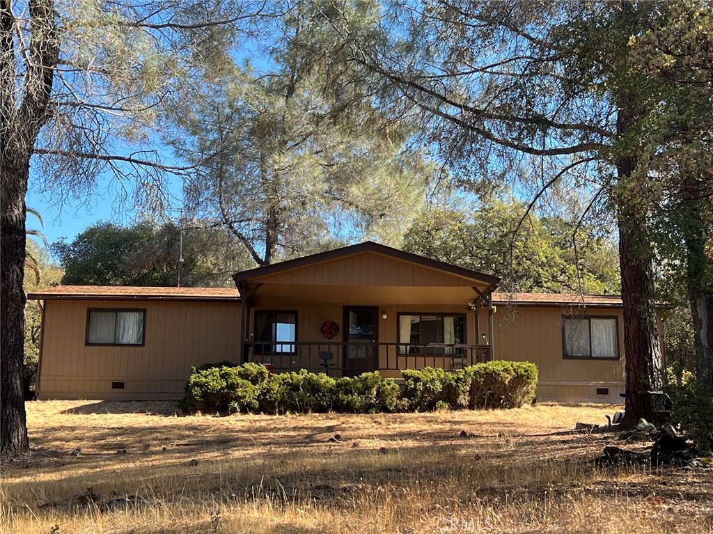 One of a kind property !! 25 acres, 6 garages, almost 2 miles of cleared trails, meadow, garden area, and a koi pond!!! PRIVATE OASIS with beautiful valley views and city lights. Home has 3 bedroom, 2 bath home with attached garage and large front porch overlooking the property and valley. Perfectly quiet and tranquil that you only hear the birds flying. 1/6 garage is attached to the home and the other 5 garages in a 28x72 shop building with wood heat. Perfect for workshops/office work. Enjoy the hiking trails that all marked. Check this place out while its still HOT!