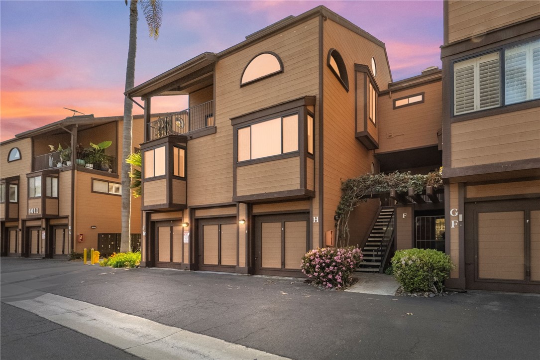 Welcome to the best of beach living, this unit is one of the few with a peekaboo OCEAN VIEW- perfectly located in Windsong Cove, a resort inspired, gated complex located just a short walk or bike from Tamarack Beach, the lagoon, and the vibrant downtown village with its shopping and dining options. This home features 1595 square feet, not including the finished bonus room off of the guest bedroom of 116 additional square feet.
The entry features a welcoming front porch, enjoy the open floor plan that includes a half bath, bright and open living room with gas fireplace, dining area and kitchen, plus a 120 square foot covered patio with westerly views overlooking the incredibly lush grounds. The upstairs features the Primary suite, with private bath and fantastic views from the spacious 120 square foot covered deck plus private outside stairs to the lower level and pool beyond. There is a spiral staircase to the versatile loft space and the laundry is between the two bedrooms. This home is light and bright with skylights and a very convenient floor plan. Windsor Cove offers a gated pool, two private Jacuzzis, outdoor restrooms, lovely covered gathering space and meandering streams and incredible lush mature landscaping. This unit features a one car garage and one designated parking space. Commute to San Diego or Orange County from the Coastal Rail just 5 minutes from this complex. This is beach living at its best. The Windsong Cove Special Roof Assessment has been determined to be $14,400 per unit; Seller will pay the full amount of the special roof assessment at close of escrow.