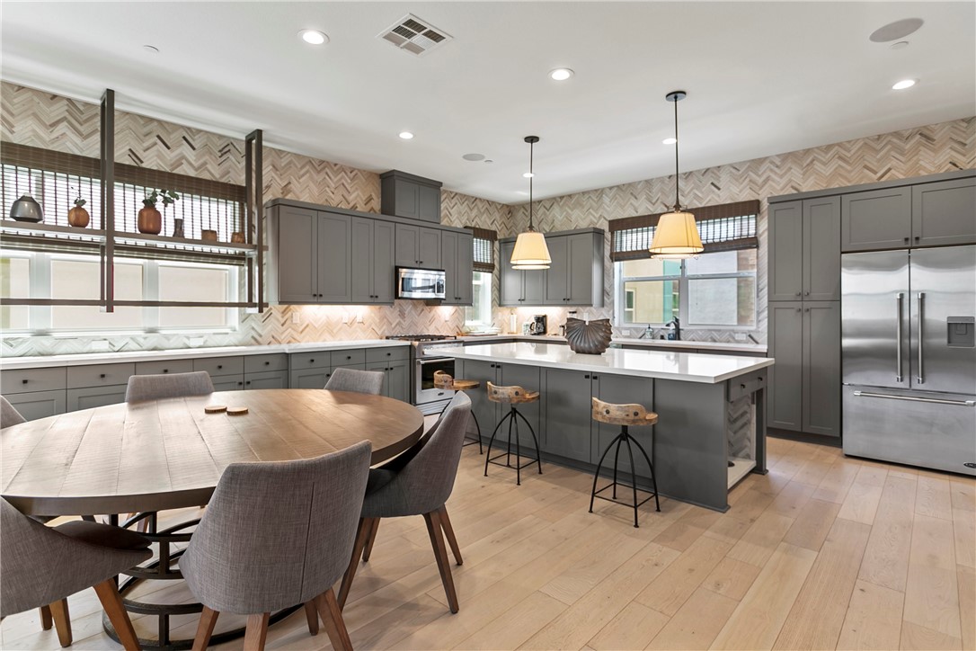 Experience designer living in this fully furnished, upgraded model townhome located in a sought-after Anaheim HOA community featuring a sparkling pool. This stunning three-level residence offers 2,277 square feet of modern luxury, complete with every premium upgrade the developer offered. The showstopping rooftop deck overlooks the community pool—perfect for entertaining or unwinding under the stars.
The open-concept main level highlights a sleek, contemporary kitchen with top-of-the-line appliances, upgraded cabinetry, and high-end furnishings throughout. A spacious home office with built-in cabinets and a separate gym with a mini fridge provide flexible spaces that can easily be converted into additional bedrooms to suit your lifestyle.
Enjoy three well-appointed bedrooms, including a private ground-floor suite ideal for guests. Upstairs, the luxurious primary retreat features an en suite bathroom with dual sinks and a walk-in shower. Additional features include central air conditioning and a two-car attached garage.
AVAILABLE FOR SHORT OR LONG-TERM LEASE. LEASE TERM MUST EXCEED 31 DAYS.