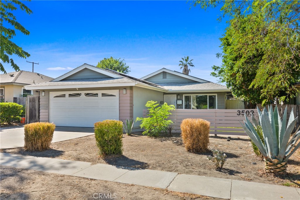 This home will delight you from the curb appeal and beyond. Lovingly maintained and upgraded. This single-story house features 3 bedrooms and 2 baths with modern and remodeled kitchens with new kitchen appliances, brand new bathrooms, new paint interior and exterior, new flooring throughout the house, PAID-OFF SOLAR PANELS and save you lot of energy cost. The house also welcomes you into a large living room, and lots of windows, the kitchen is filled with plenty of storage space and the cabinets have roll-out shelves. A breakfast bar provides space for convenient casual dining. The kitchen is open to a very generous size dining room with a sliding door to a private backyard with free-standing patio cover. Three good-sized bedrooms with new flooring throughout and the master bedroom has branded new bathroom as well. The well-established and less maintenance backyard provides opportunities for family gatherings and entertainment. This home is certainly turn-key and waiting for a new family. Close to shops, schools, parks, easy access to Fwy 5 and Disneyland.