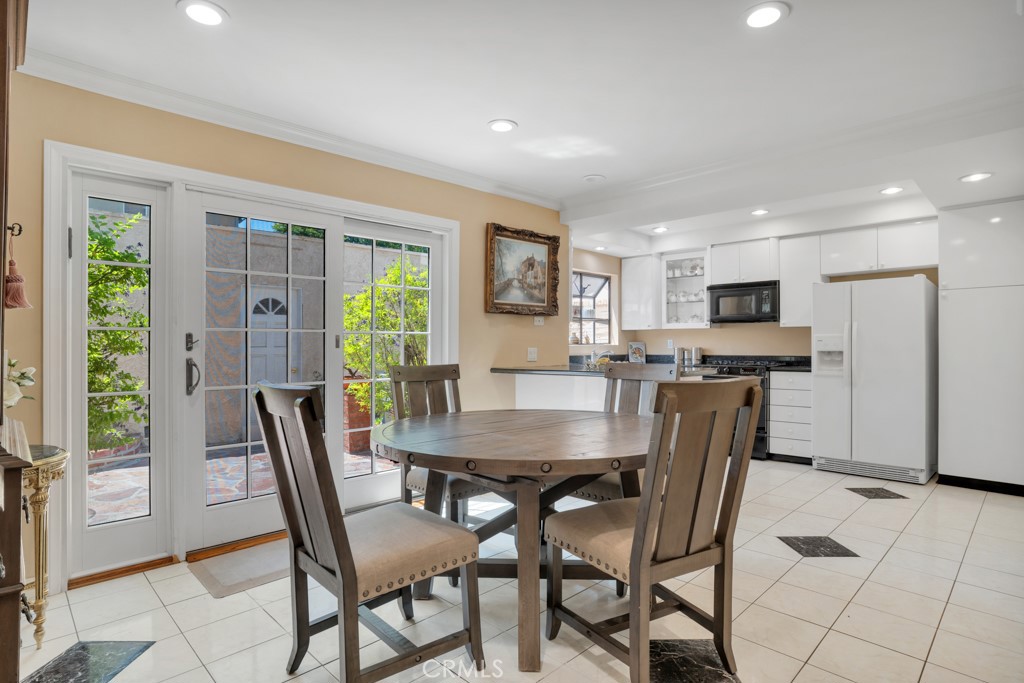 Welcome to the highly desirable gated community of ‘Tarzana Oaks'. This wonderful light & bright 3 Bedrooms and 3 Baths 1,673 square feet townhouse feels as a single family home with its 2 car attached garage, and private patio. Tastefully updated, featuring wood-like floor and marble downstairs and wood-like floor upstairs, recessed lighting throughout, and dual pane windows. As you enter the home you will be greeted by the spacious living room with a gas fireplace, and large windows bringing in lots of natural light through the wood plantation shutters, a formal dining room, a wet bar, a powder room, and an amazing chef kitchen with white cabinets, granite counters ,and a convenient breakfast counter bar. Upstairs are the 3 bedrooms. Two good size bedrooms share a full bath, and a large master bedroom with high vaulted ceiling, a convenient walk-in closet, and an en-suite master bath. The private patio is great for entertaining & having fun summer barbecues, with upgraded floor of Idaho flagstones.
The garage is conveniently attached to the unit, it has overhead storage space. One of the better locations within the complex away from the main street in a private area. HOA includes basic cable TV, a discounted rate of internet service, water, trash, sewer, earthquake insurance.
The gated community offers a sparkling pool with seating area under a large gazebo, surrounded by resort style trees with pool furniture, a gated kids playground, and guest parking. Walking distance to parks, restaurants, shops, places of worship, easy freeway access, and the orange bus line station. This is an amazing opportunity, and a must see home, Make it yours Today!