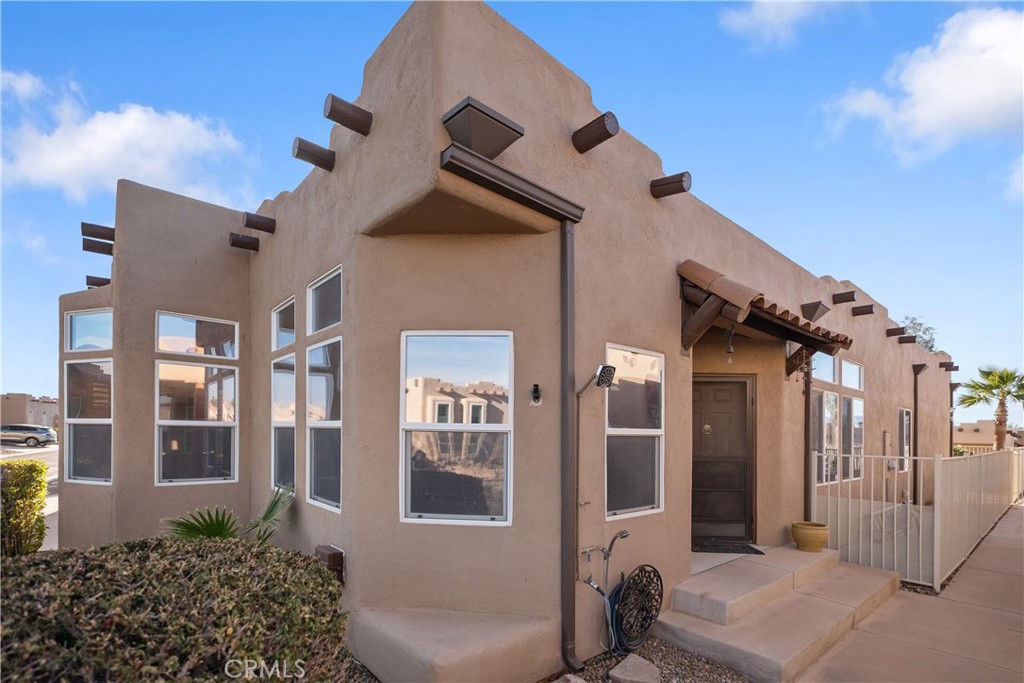 Welcome to the highly sought-after community of Rio Buena Vista. This home is centrally located and features 3 bedrooms (1 is a den with a fireplace and skylight) and 2 bathrooms. The breathtaking kitchen remodel includes an island, a pantry, a breakfast nook, and every amenity you can imagine. The bedroom suite bath has dual sinks, a garden tub, and a separate walk-in shower. The guest bath has a skylight. This home offers a separate dining room and a separate laundry room. The backyard is completely enclosed and creatively designed with a covered patio, built-in gas and charcoal BBQ Island, gas fire-pit, 3 gas Tiki torches for entertaining or enjoying the peaceful but spectacular desert sunsets, and plenty of space perfect for entertaining. A few detailed upgrades throughout this one-of-a-kind home are new flooring, dual plantation shutters, new interior and exterior paint, Bluetooth surround sound, a Kinetico water softener system, and an osmosis system. There is a new A/C, a garage roof, and a garage door opener. The community has beaches with golf cart parking, a river walk, a basketball/volleyball court, a pool, and a spa, all for its residents' use. Let's remember to mention it's only steps to the water!