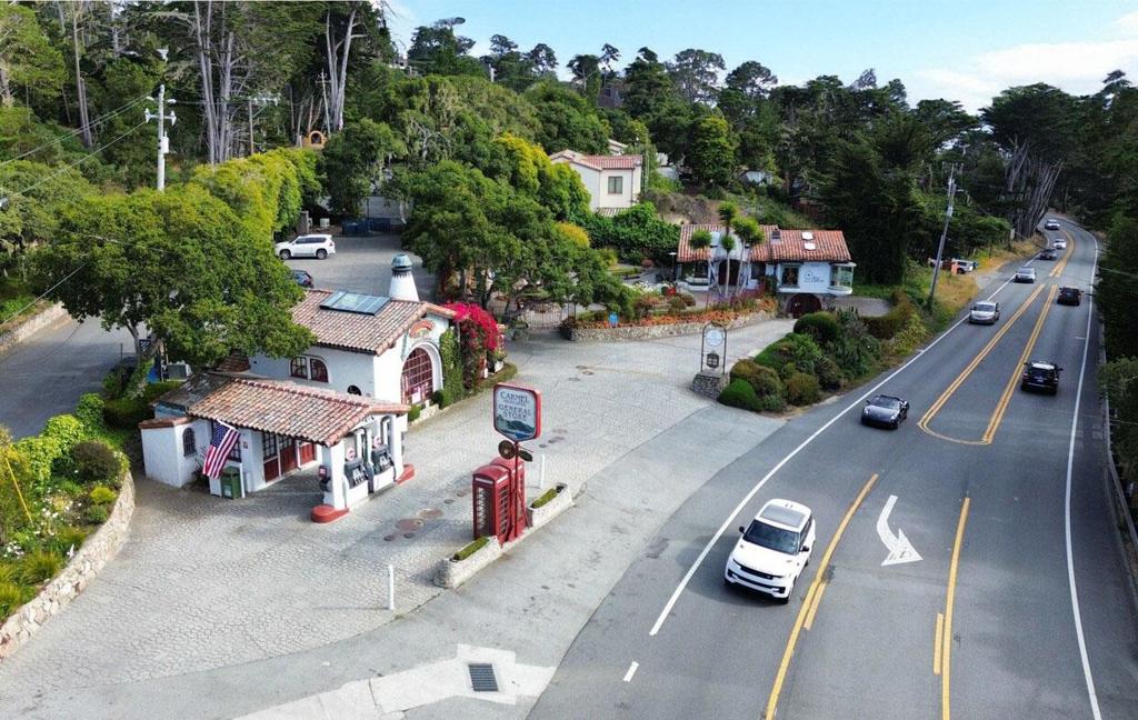 For sale for the first time in over 40 years. Once operated by the Carmel Highlands Inn Hotel, this iconic offering includes the well-established fuel and general store business, as well as the meticulously maintained garden/parking area and gallery building. The property has has been the backdrop for countless advertisements and has hosted weddings, parties, car clubs. Most famously this property was the inspiration and venue for the original Casa Ferrari events in 2015 and 2016. With over 250 feet of frontage on Highway 1 in the heart of the Carmel Highlands, the property benefits from the approximately 40,000 vehicles per day that drive by. The buildings on the property, the stamped concrete hardscape areas, and the garden grounds reflect the meticulous care and stewardship, making the property as visually inviting as it is functional. This rare offering presents an exceptional opportunity to own a piece of Californias coastal heritage in one of the most picturesque locations in the world.