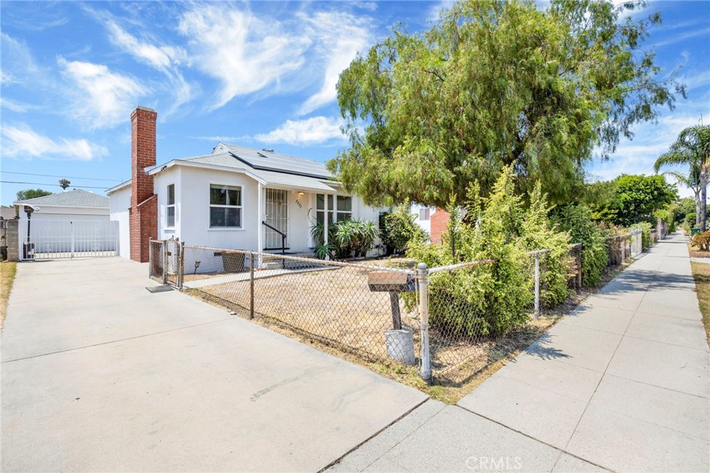 Located in one of North Hollywood’s most sought-after neighborhoods, 7931 Vantage Avenue is a meticulously maintained 3-bedroom, 2-bathroom home with an INDIVIDUAL OFFICE ROOM, offering the perfect blend of modern comfort and timeless charm. Set on a spacious 7,500+ SQFT LOT, this property is ideal for investors, builders, or families looking to customize their dream space. Inside, you'll find refinished original hardwood floors, smooth ceilings, fresh paint, recessed lighting, ceiling fans, and a cozy gas fireplace that adds warmth and character. The living room flows seamlessly into the dining area and updated kitchen, which features newer appliances, granite countertops with a complementary backsplash, and quality wood cabinetry. The guest bathroom includes granite counters, stylish tile flooring, a large shower niche, and a tub/shower combo. The remodeled primary bathroom features a sleek modern vanity and elegant marble-style tile surrounding the tub/shower combo. Additional highlights include a security door, and a dedicated laundry room with tile floors and built-in storage. Major energy-efficient upgrades include: PAID OFF SOLAR PANELS with a new panel box, NEW AC/HEAT SYSTEM, new water heater, double-paned windows, and a brand-new water pressure regulator pump. One of the most exciting aspects of this property is its income-generating potential. The primary bedroom and bathroom can be closed off and converted into a studio-style guest suite or ADU, with a private side entrance, allowing you to retain a 3 bed, 1 bath main house. In addition, the DETACHED 2 CAR GARAGE is a prime candidate for a full-size ADU, maximizing the possibilities on this oversized lot. Step outside to a beautifully landscaped backyard with mature lemon trees from the original orchard dating back nearly a century. Enjoy effortless outdoor living under the wood pergola, set on low-maintenance decorative gravel and surrounded by greenery. The backyard also features both sprinkler and drip irrigation systems, full block wall fencing for added privacy, and a Tuff shed with nearby power outlets—perfect for a future jacuzzi setup or additional storage. With classic character, modern upgrades, and endless potential to expand, customize, or generate rental income, this home is truly a rare gem. Located just minutes from parks, shopping, dining, the NoHo Arts District, and major freeways. Opportunities like this, offering size, location, charm, and flexibility don’t come around often!