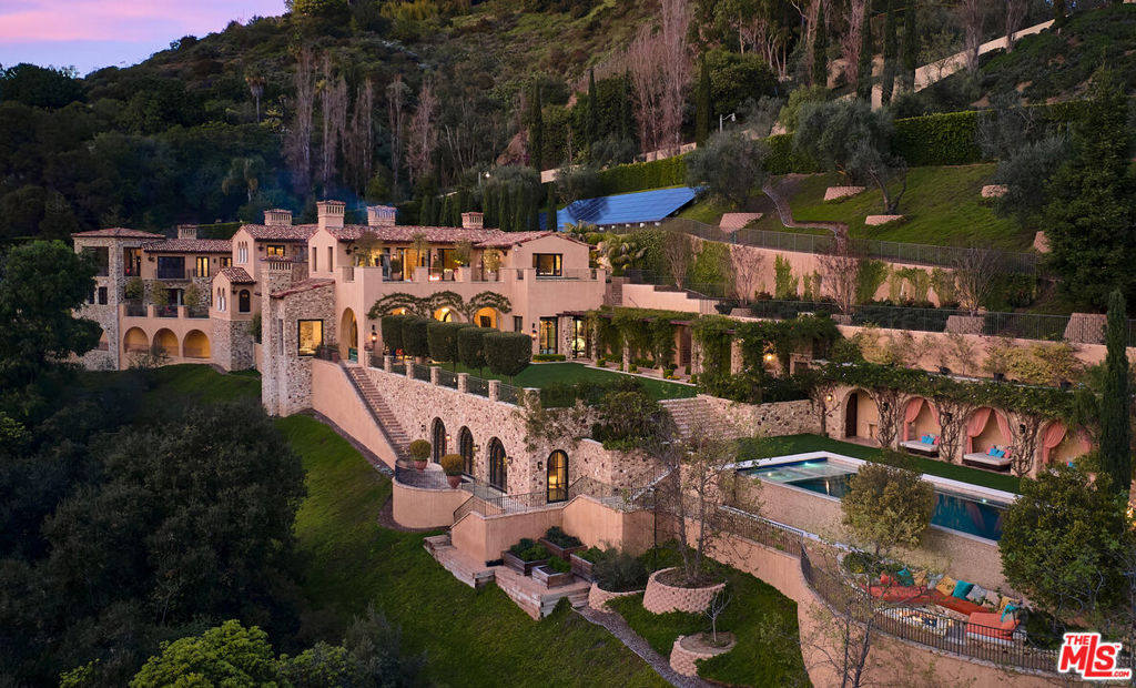 Welcome to Villa Del Amor, the epitome of luxurious living in a custom European villa nestled in the prestigious enclave of Lower Bel Air. Hovering over the esteemed Bel Air Country Club Golf Course, this remarkable residence offers unparalleled privacy and exclusivity. Crafted with meticulous attention to detail, this exceptional estate boasts the finest materials and craftsmanship, showcasing exquisite European-inspired architecture. From its grand facades adorned with intricate stone work to its expansive interiors with soaring ceilings, every aspect of this home exudes opulence and sophistication. Spanning across a sprawling lot, the property enjoys sweeping views of the lush fairways and beyond, creating a serene and picturesque setting. The meticulously landscaped grounds feature manicured gardens, tranquil pathways, and a resort-style pool area, offering a perfect blend of tranquility and outdoor entertainment. Step inside to discover a world of elegance and grandeur, with spacious living areas designed for both lavish entertaining and intimate gatherings. The gourmet kitchen, outfitted with top-of-the-line appliances and custom cabinetry, is a chef's dream, while the formal dining room provides a refined space for hosting memorable dinners. Retreat to the sumptuous master suite, complete with a luxurious bathroom and private terrace and spa overlooking the golf course. Additional bedrooms and amenities, including a private study, media room, and fitness center, ensure every comfort and convenience is catered to. With its idyllic location, impeccable craftsmanship, and unparalleled amenities, this European masterpiece offers a rare opportunity to experience the ultimate luxury living in the heart of Bel Air.