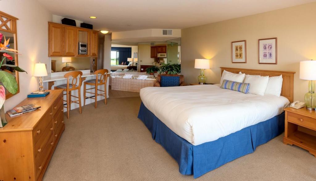 IF YOU ARE LOOKING FOR A BEACH GET A WAY, THIS MIGHT BE THE PROPERTY FOR YOU. THIS IS LIKE BUYING A DUPLEX AT A RESORT. THERE ARE 2 DELUXE STUDIOS OPERATED INDEPENDENTLY AND SOLD AS ONE CONDO. YOU CAN USE ONE SIDE AND RENT THE OTHER, RENT BOTH OR USE BOTH WITH A CONVENIENT ADJOINING DOOR. PROVEN RENTAL HISTORY.