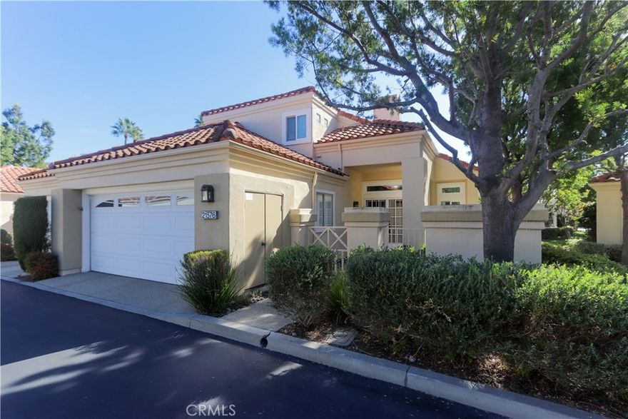 Senior Community Over 55 Palmia.  Light, bright, living on the ground floor in primary suite with attached bath overlooking patio and garden.  Direct unit access from 2 car garage.  Kitchen well appointed with top quality stove and lots of storage.  Garden window in kitchen.  Dinning room with sliding door access to covered patio backs up to a small greenbelt.  One common wall with adjacent unit.  Hardwood floors throughout.  Upstairs is office/loft plus full bath and separate guest bedroom.  Palmia community includes many activities/clubs with clubhouse, pickleball courts, putting green, pool, exercise room, XL community and game rooms.  Ask about Mission Viejo Lake privileges.