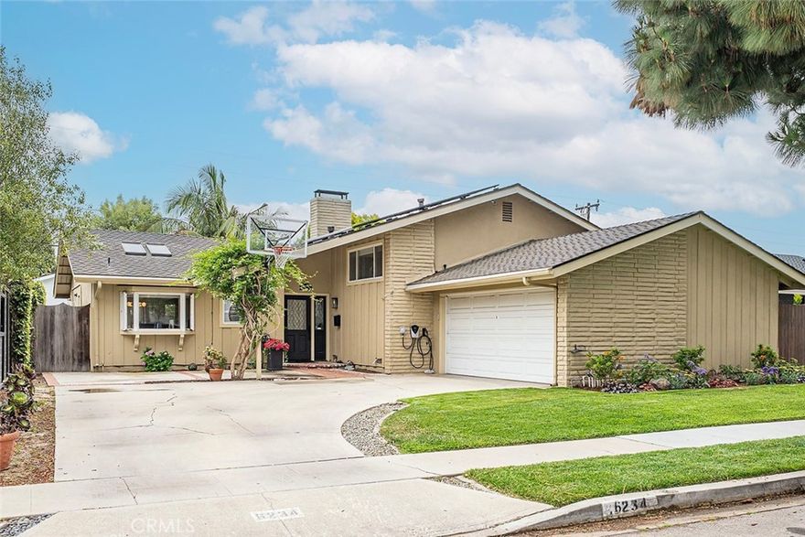 Discover this stunning tri-level home in coveted University Park Estates. This meticulously upgraded residence offers a blend of modern aesthetics, functionality, and comfort. Step inside to an inviting open-concept main floor plan featuring vaulted ceilings, new CALI natural hardwood flooring, a palette of designer paint, and striking mid-century modern lighting. The spacious living and dining areas are designed for gatherings, complemented by a cozy gas fireplace with a newly refurbished hearth. The space seamlessly transitions to a wonderful backyard, featuring a brand-new Pergolux motorized pergola with heater, a hot tub, built-in barbecue, and lush landscaping with fruit trees. Back inside, the living areas are open to the kitchen featuring custom cabinetry, stainless appliances including a Viking 6-burner range, solid-surface countertops, and a convenient eat-at counter. A stylish guest powder room completes the main level. A standout feature of this home is the expansive lower-level family room, offering a versatile space for both relaxing and entertainment, in addition to a newly constructed room that can serve as an office or guest area. The lower level is complete with a remodeled half-bath, laundry room, and extra storage. A modern staircase leads to the upper level with three bedrooms and two bathrooms. The primary suite has been elegantly remodeled to include an en-suite bathroom with an oversized shower, quartz countertops, and a spacious walk-in closet with California Closet organizers. Two additional bedrooms with a fourth remodeled bath completes the upper level. The home offers upgrades such as a new Bosch 5-ton AC with a heat pump, leased Sun Run solar panels with a Dual-Tesla Firewall, wired for a level-2 EV charger, LED recessed lighting, new overhead bedroom fans, a two-car garage, and a new sewer line/cleanout. This neighborhood offers access to award-winning schools, scenic bike paths, and a charming neighborhood park. It's conveniently located near the new PCH & 2nd shopping area, Naples, Belmont Shore, and the coast, providing array of restaurants, shopping, entertainment, and recreational activities. With its proximity to major freeways, this home ensures effortless connectivity to everything you need. Don't miss your chance to live in this exceptional home in wonderful University Park Estates!
