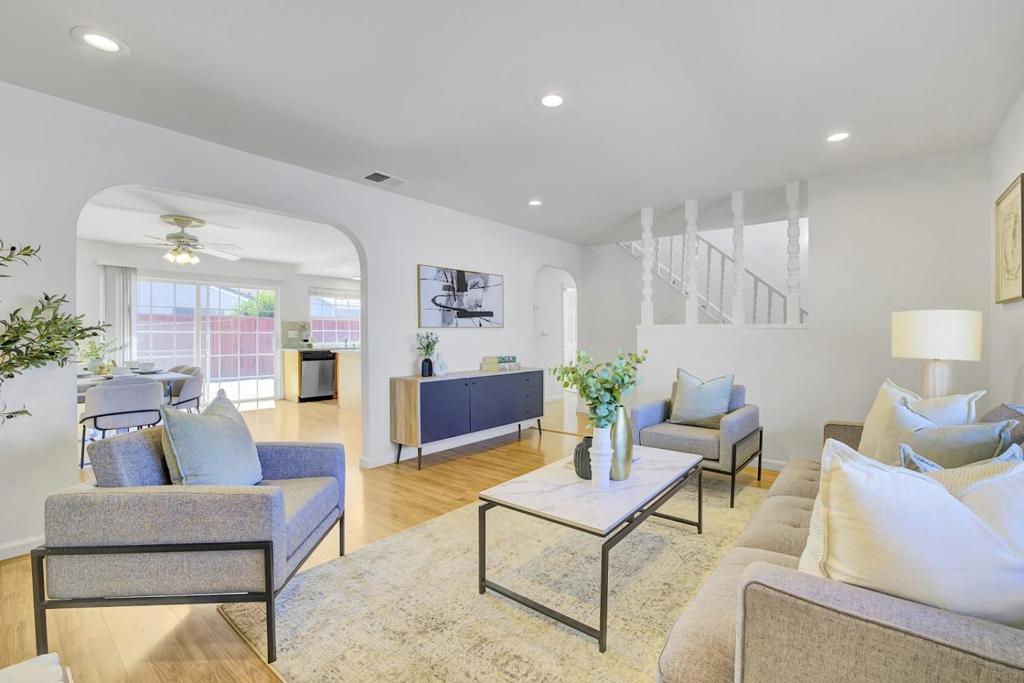 Welcome to this inviting 4-bedroom, 3-bathroom home located in the vibrant city of San Jose. With 1,936 square feet of living space, this well-maintained home offers a comfortable and functional layout. The home features a bright and expansive living room with a cozy fireplace, perfect for relaxing or entertaining. The kitchen opens to the dining area, creating a bright and airy space filled with natural light and a sense of openness. It includes a spacious primary suite and an additional bedroom on the main levelideal for multi-generational living, guests, or a home office. Upstairs, you'll find two more generously sized bedrooms and another full bathroom, providing privacy and flexibility for family living. The interior has been freshly painted, adding to the home's move-in readiness. Step outside to enjoy a spacious backyard ideal for gatherings or outdoor enjoyment, and a charming front courtyard that enhances curb appeal and provides an additional peaceful retreat.
