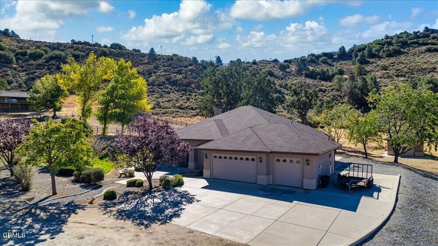Your Mountain Sanctuary! Welcome to this mountain retreat in the gated community of Bear Valley Springs where space, comfort, and nature come together beautifully. This impressive 3BD/2.5BA home offers 2,861 SF of refined living on 3.43 acres with endless views and direct access to equestrian trails.A gracious foyer framed by graceful archways sets the tone, opening to a dedicated office on one side and a formal dining room on the other. Beyond, the heart of the home unfolds into a spacious open-concept living area featuring custom built-ins, a large tiled hearth, and a cozy pellet stove. The kitchen is both functional and elegant, showcasing granite countertops, stainless appliances (including a dual-drawer dishwasher), a walk-in pantry, breakfast nook, and an eat-at island with prep sink.The split-wing layout ensures privacy with two bedrooms and a full bath on one side, while the expansive primary suite on the other includes patio access, dual vanities, soaking tub, walk-in closet, and private yard entry.Enjoy outdoor living on the covered patio overlooking the mountains. The property also features a detached single-car garage with workshop area, oversized 3-car garage, RV parking, and room for horses. Additional amenities include central A/C, portable generator connection, water softener, and rain gutters. Every room captures stunning natural vistas becoming a daily reminder that this is more than a home, it's a lifestyle.