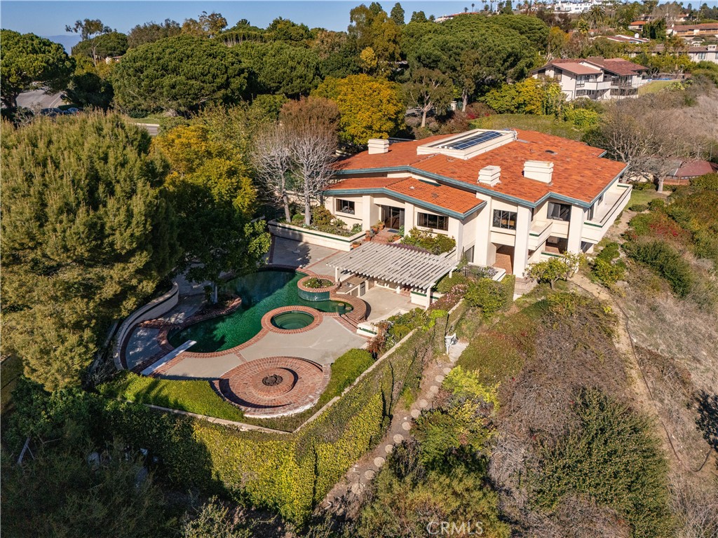 Spectacular Ocean & Catalina Views – A Rare Luxury Estate! Experience breathtaking views from this expansive estate, boasting over 7,700 sq. ft. of living space on an impressive 65,479 sq. ft. lot. Designed for both grand entertaining and intimate gatherings, this home features multiple living and dining areas, two family rooms, and a gourmet center-island kitchen. The luxurious master suite is a private retreat, complete with a spa-like bath and sauna.
Step outside into a resort-style backyard, where lush landscaping surrounds multiple seating areas, a sparkling pool and spa, a tennis court, and unobstructed ocean views extending to Catalina. A private gated entry and expansive driveway provide security and convenience, making this home perfect for hosting guests.