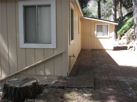 Photo of 21636 Sawpit Canyon Rd, Cedarpines Park, CA 92322 (MLS # IG26048531)