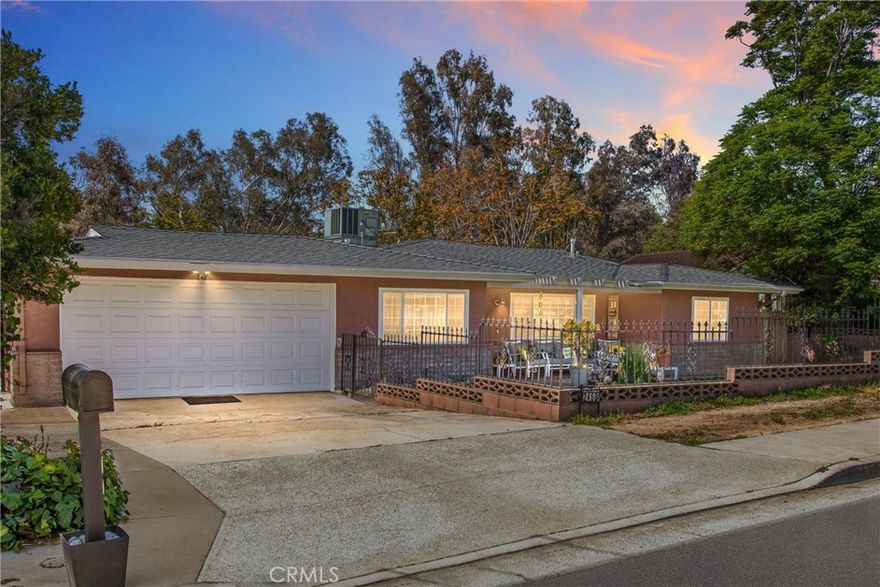 Beautiful Single-Story Pool home with an attached Mother-N-Law Quarters. Perfect for multi-generational living, entertaining, or simply relaxing in your own private retreat. Situated on a spacious lot, this home features a versatile layout with a separate guest/in-law suite at the back of the house. Whether used as a one-bedroom apartment, pool house, or private quarters, this flexible space adds tremendous value and convenience. The freshly painted exterior and brand-new energy efficient roof offer great curb appeal, while inside, you’ll find a light-filled interior with new neutral paint and high-end vinyl plank flooring throughout. The remodeled kitchen is a true highlight, featuring an oversized deep-dish sink, sleek new appliances, ample storage, updated cabinetry, new counters, and a stylish backsplash. The adjoining dining area and open family room create an inviting space to gather and unwind. Both bathrooms have been beautifully renovated with modern vanities, fixtures, and mirrors, giving them a luxurious, spa-like feel. The spacious bedrooms are filled with natural light, enhancing the home’s airy and welcoming atmosphere. Additional features include: A spacious garage with extra storage, Room in the driveway for a small RV or boat, Newer dual-paned windows that are energy efficient, sound resistant, and with a 16-year warranty, No HOA or Mello-Roos tax. Step outside into your private backyard oasis—an entertainer’s dream with a large pool and a tranquil fountain pond. Conveniently located near top rated schools, shopping, and entertainment, this home offers the perfect balance of elegance, practicality, and lifestyle. Don’t miss your chance to own this stunning, move-in-ready gem. Schedule your private tour today!