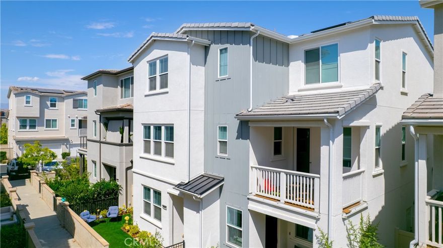 Welcome to this beautifully maintained, truly turnkey 2-bedroom home with a versatile ground-level flex space with just ONE LOW HOA fee of $304!!! This residence offers an ideal blend of style, function, and modern upgrades. The ground-level flex space offers endless possibilities—perfect for a private home office, personal gym, or creative studio—providing quiet separation from the rest of the home. You will find luxury vinyl plank flooring in the kitchen and living rooms, upgraded carpet in the den and bedrooms, and wooden blinds throughout. The open kitchen is a chef’s delight, showcasing quartz countertops, a full tile backsplash, walk in pantry and stainless-steel appliances. Upstairs, the primary suite offers dual closets (including a fully customized system in one), a barn door entry to the en-suite bath, and a beautifully tiled-to-ceiling shower for a spa-like feel. The secondary bedroom is generously sized—large enough to accommodate two beds—making it perfect for kids or guests. Outdoor living is equally impressive, with a large porch at the entry, a second-story deck, and a backyard with a covered patio—offering multiple spaces for entertaining and relaxation. The landscaped front yard features low-maintenance turf, vibrant flower beds, a lemon tree, and a drip irrigation system. The side yard is equally charming with a decked patio, flower boxes, succulents, hanging lights, and a Ring motion sensor on the gate. Additional highlights include a 2-car garage with epoxy-coated floors and an EV charging station. Smart home features such as keyless entry on both the garage and front doors, a Ring doorbell, and a security system enhance everyday convenience. Energy-efficient upgrades complete the package, including leased solar, an LG Wash Tower with center controls, a tankless water heater, Energy Star appliances, and double-pane windows throughout.

Enjoy access to award-winning amenities such as baseball fields, playgrounds, sports park, The Canyon House, Blue Hummingbird Coffeehouse, The Pond, Lagoon and Lake, Camp Out facility, resort-style pools, the farms, an arcade, state-of-the-art gyms, parks and much more!