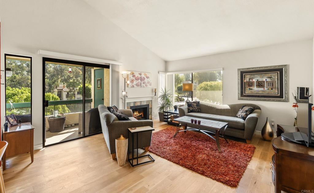 Beautiful Top-Floor Corner Unit with Vaulted Ceilings This stunning corner penthouse at 11255 Tierrasanta Blvd. #119 is a RARE FIND — offering no shared walls and soaring vaulted ceilings. Flooded with natural light, the open-concept living space features wood-look flooring, a cozy fireplace, and a seamless flow from kitchen to dining to living areas. The gourmet kitchen showcases rich Cherry wood cabinetry, granite countertops, stainless steel appliances, a deep farmhouse sink, and stylish pendant lighting. A vibrant accent wall adds charm to the dining area, while large sliding doors bring in fresh air and lush greenery. The spacious primary suite offers a walk-in closet plus an additional closet, and both bathrooms have been updated with modern vanities and lighting. Additional conveniences include close proximity to the elevator, in-unit laundry hookups, and a dedicated storage locker. Enjoy resort-style living with community amenities including a sparkling pool, relaxing spa, Jacuzzi, sauna, and tennis court that also accommodate pickleball. HOA dues cover water, trash, gas for the fireplace, and Wi-Fi/cable service through Spectrum. There may also be a possibility for a second parking spot — to be confirmed with the HOA; however, per the owner there is plenty of guest parking. All this in the heart of Tierrasanta — close to shopping, dining, and easy freeway access.