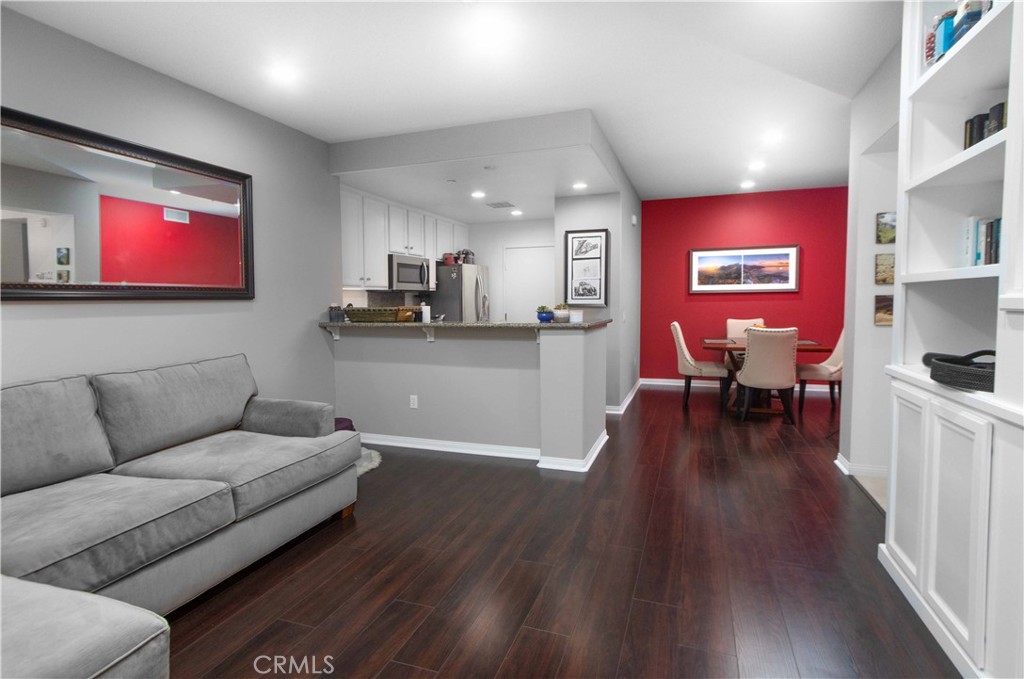 Welcome to this spacious first-floor condo, where a bright, open layout and airy design create an inviting atmosphere from the moment you step inside.
The living area features a built-in entertainment system with a 65” Sony HD TV included with the rental, combining modern style with everyday convenience. Expansive windows fill the space with natural light, enhancing the warm and welcoming feel.
The updated kitchen boasts stainless steel appliances, sleek granite countertops, and ample cabinetry—perfect for both everyday cooking and entertaining guests. For added convenience, a full-sized washer and dryer are included in the unit.
The thoughtfully designed bedroom offers comfort and functionality, with generous closet space and plenty of additional storage throughout the home. An attached garage provides both convenience and secure parking.
As part of this vibrant community, residents enjoy access to exceptional amenities including multiple pools, Jacuzzis, parks, a fitness center, tennis courts, and more. Ideally situated next to the Quail Hill Shopping Center, the condo also offers quick access to the 405, 133, and 5 freeways. The Irvine Spectrum, top restaurants, and grocery stores are just minutes away.
