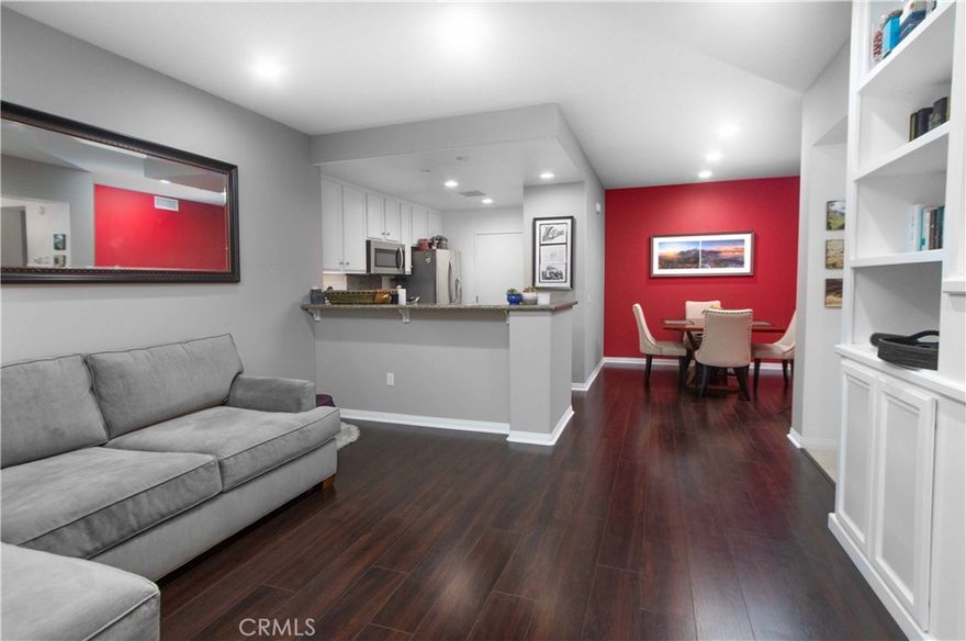 Welcome to this spacious first-floor condo, where a bright, open layout and airy design create an inviting atmosphere from the moment you step inside.



The living area features a built-in entertainment system with a 65” Sony HD TV included with the rental, combining modern style with everyday convenience. Expansive windows fill the space with natural light, enhancing the warm and welcoming feel.



The updated kitchen boasts stainless steel appliances, sleek granite countertops, and ample cabinetry—perfect for both everyday cooking and entertaining guests. For added convenience, a full-sized washer and dryer are included in the unit.



The thoughtfully designed bedroom offers comfort and functionality, with generous closet space and plenty of additional storage throughout the home. An attached garage provides both convenience and secure parking.



As part of this vibrant community, residents enjoy access to exceptional amenities including multiple pools, Jacuzzis, parks, a fitness center, tennis courts, and more. Ideally situated next to the Quail Hill Shopping Center, the condo also offers quick access to the 405, 133, and 5 freeways. The Irvine Spectrum, top restaurants, and grocery stores are just minutes away.