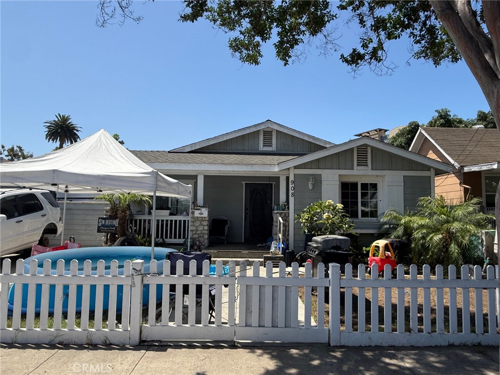 Craftsman style home in a great area of Santa Ana. Home is spacious with 3 bedrooms, 2 baths with central air. Home offers good size lot with RV parking, two car garage with attached Studio, offering estimated 300 sqft multigenerational living area includes bathroom and kitchenette. Great opportunity.