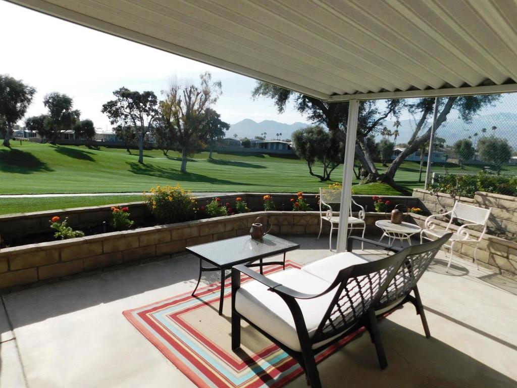 Welcome to a bright and inviting golf course oasis nestled in one of the most scenic pockets of Palm Desert. Situated at the end of a six-home cul-de-sac, this beautifully updated home offers a perfect blend of tranquility, space, and sweeping fairway views. This home features THREE well-appointed bedrooms and THREE bathrooms, offering both flexibility and privacy that suit families, seasonal visitors, and full-time residents alike. One of the standout advantages is the dual layout of two primary bedrooms, each with generous en-suite bathrooms. Whether you have guests staying long-term or you enjoy the extra space for yourself, this thoughtful design opens up numerous lifestyle options. The third bedroom also provides exceptional functionality--it's perfect as an office space, additional guest room, or den, depending on your needs. Inside the home, you'll find an updated kitchen that sits conveniently at the heart of the residence, easily accessible from all main living spaces. Designed for both style and function, the kitchen connects naturally to a dining area that boasts stunning views of the golf course. The adjacent family room also makes the most of the home's incredible vantage point. Whether you're sipping morning coffee or catching up with friends in the evening, the serene view of the 5th tee, 6th hole, and 7th tee creates a slightly surreal, postcard-style backdrop. Step outside and your appreciation for this home will only grow. The oversized lot allows for a vast outdoor living space, where a huge covered patio spans across the rear of the property. This area is perfect for hosting barbecues, sharing meals al fresco, or just kicking back with a glass of iced tea and watching golfers navigate the course. With ample shade and room for both seating and dining arrangements, the patio extends your living area into the outdoors--an important feature for those who love to entertain or simply take in the desert ambiance. To top it off FREE golf is included in low monthly dues. Free internet and trash pickup, clubhouse with a restaurant, bar, 18-hole executive golf course and pro shop, three community pools, hot tubs and exercise room. Add a billiard room, card room, indoor shuffle board, tennis courts, pickle ball courts, library, recreation room, and nearly 40 clubs to realize all that PDGCC offers for your perfect desert home. This incredible home won't last long! Please call for a showing.