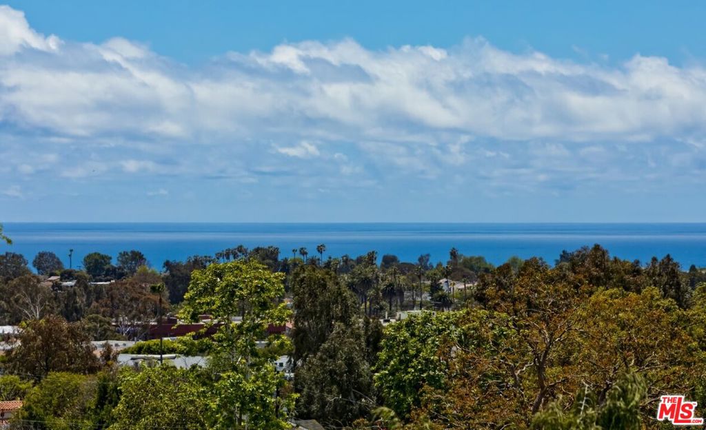This nearly 6,600 sq ft lot provides the opportunity to build a generous 3,234 sq. ft. main residence, and a detached ADU of up to 800 sq. ft using the fast track permit process. The estimated maximum allowable building area on this lot is approximately 3,892 sq ft for the main residence and up to 800 sq. ft for an ADU. Located on one of the most desired view streets just blocks from Palisades Village, 14930 McKendree presents a rare opportunity to craft your dream home in an unbeatable location. Offering breathtaking panoramic views, this special property is framed by the serene beauty of canyon trails and the ocean. Whether you are envisioning enjoying a quiet morning or entertaining at sunset, the vistas here are nothing short of breathtaking. With easy access to scenic hiking trails leading into Temescal Canyon and Will Rogers State Park, outdoor adventure is always just moments away. Debris clearance on the property has been completed and a comprehensive feasibility study is available. A home is more than a place - it's where memories are made, ideas are created and where new chapters begin; 14930 McKendree offers the perfect canvas to start your next chapter!