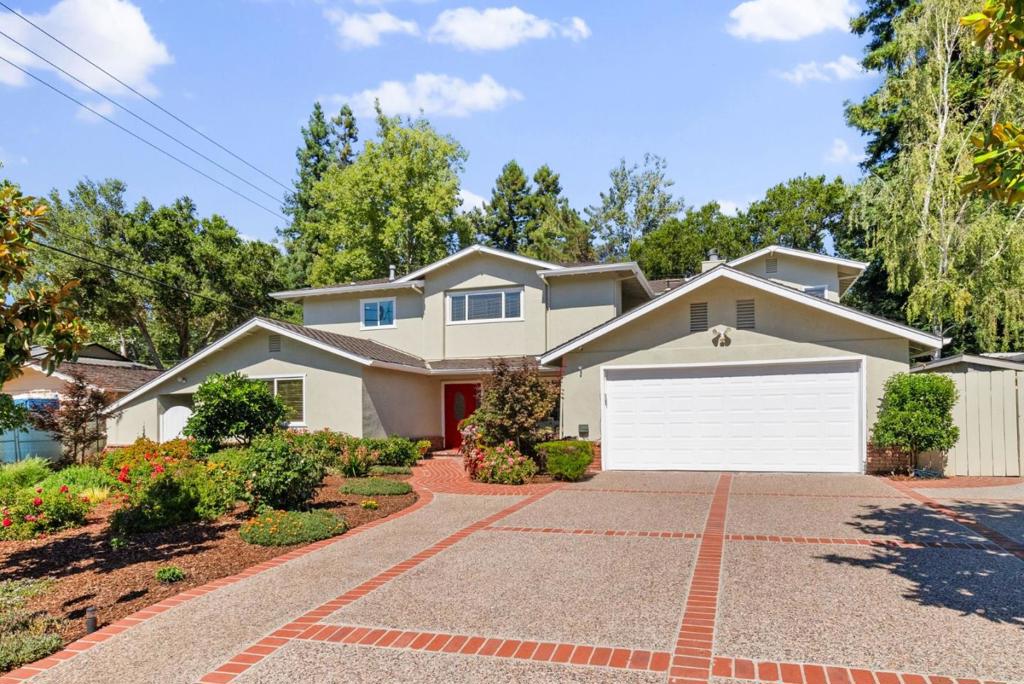 Welcome home to 10500 Creston Dr! Nestled in a serene Los Altos neighborhood, this luxurious, expansive home blends modern elegance with timeless charm on a generous 13,860 SF lot. Renovated in 2007 and 2024 with permits, it showcases a gourmet kitchen with high-end Thermador® appliances, luxury quartz countertops, stylish white oak flooring, and a spacious island with sink and seating. Two primary suites, including an upstairs retreat with a private balcony overlooking the backyard and mountain views, plus a large den for family recreation, make it ideal for multigenerational living. Open living and dining areas with elegant bamboo floors flow seamlessly to a park-like backyard featuring a sparkling pool, covered patio, a cozy treehouse, and a hammock for serene afternoons by the creek. A koi tank and fresh landscaping enhance curb appeal, while modern upgrades include new HVAC with Nest, water heater, and security cameras. Award-winning Stevens Creek Elementary, Kennedy Middle, and Monta Vista High. Convenient to Apple, Google, Nvidia, Hwy 280/85, parks, library, cafe, grocery stores, shopping, and various choices of dining.