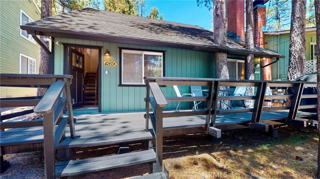 Welcome to your cozy mountain escape in the heart of Moonridge! This classic cabin with offers privacy, charm, and the true Big Bear experience. This 3-bedroom, 2-bath home is completely turnkey for a vacation home or short-term rental. Inside, enjoy rustic wood details, a welcoming brick fireplace, and an open living area perfect for relaxing after a day on the slopes. Step outside to a spacious deck ideal for entertaining or enjoying peaceful forest views. Conveniently located near Bear Mountain Resort, the golf course, the zoo, and Big Bear Lake. Whether you’re looking to generate rental income or enjoy your own peaceful retreat, this cabin is move-in ready and full of potential. Don’t miss this opportunity!