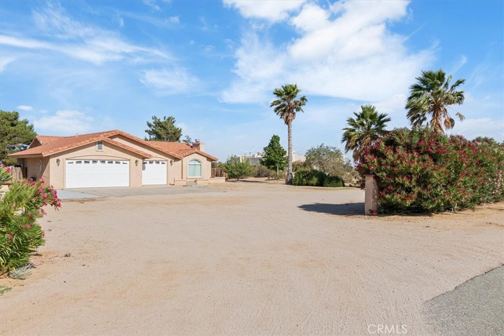 Nestled on a quiet, dead end street, this home offers plenty of peace and privacy with its 2.5 acres! Homes on this street are not often for sale making this a rare opportunity to own your piece of serenity with some beautiful sunset views. Among all the open space you'll ever need, you also have RV access with full hookups, an expansive three car garage, and a custom backyard patio for daily enjoyment or entertaining. This Large lot has plenty of space for all your toys, the homestead of your dreams and maybe even a new chicken coop too! You can also dirt bike and UTV straight from your own driveway! Inside you'll find three bedrooms, two baths, a kitchen with plenty of cabinet space and a pellet stove in the main area to help cut down those winter propane bills. Only 20 minutes to North gate at Edwards AFB makes this home ideal for military families; and a quick drive in either direction takes you to shopping and restaurants in the AV or Tehachapi. Don't miss out on this opportunity and come see why this home is more than meets the eye.